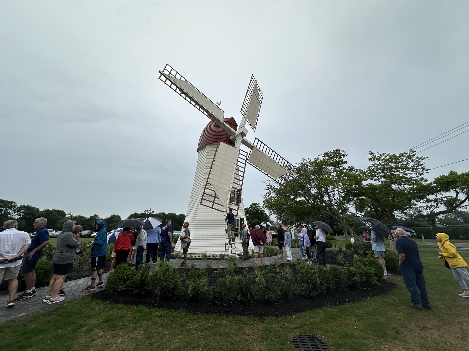 Local residents gathered at the Gov. John Adams Dix Windmill for a ribbon cutting on Wednesday, July 2. DAN STARK
