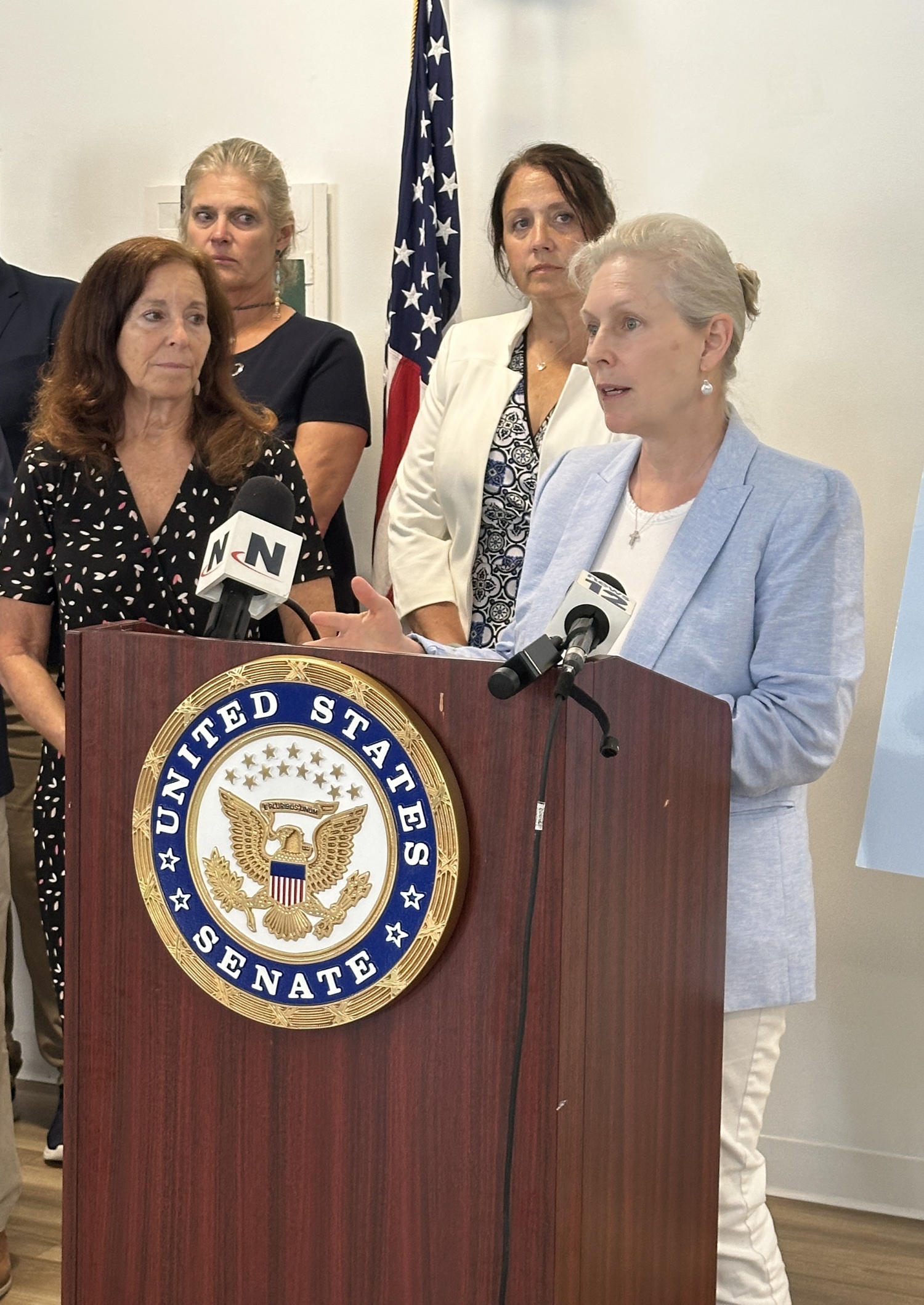 Senator Kirsten Gillibrand speaking in Riverhead on Monday, July 21, about proposed budget cuts to the National Estuary Program. DAN STARK
