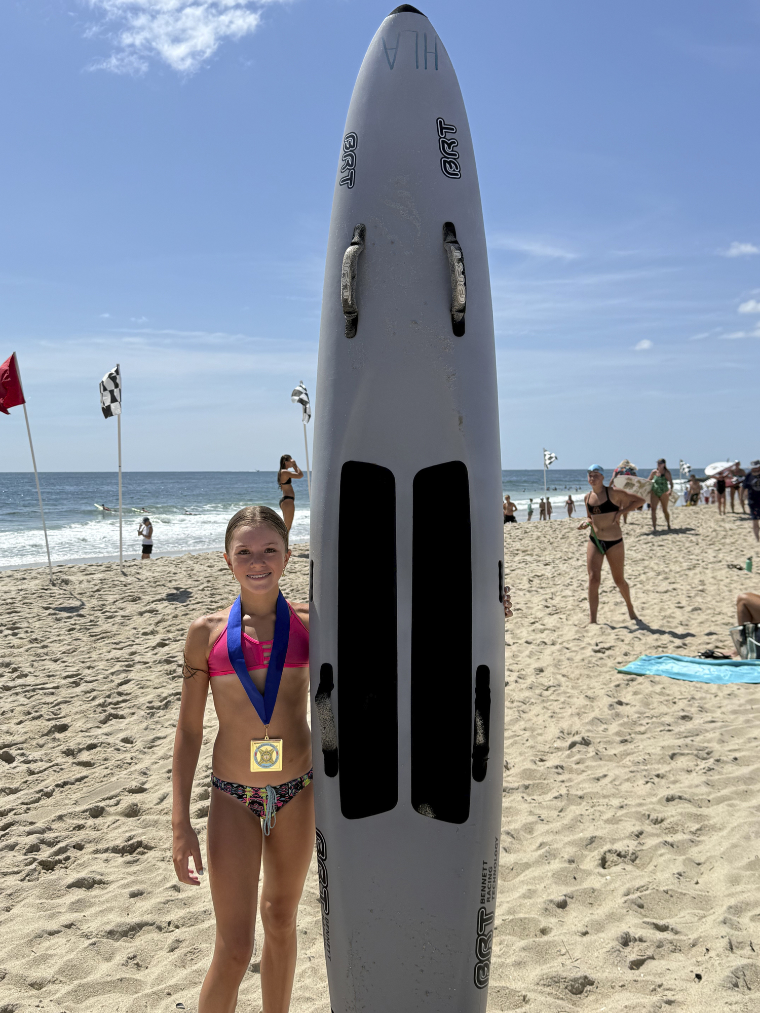 Evelyn Rizzo with her paddleboard. COURTESY SEAN KNIGHT