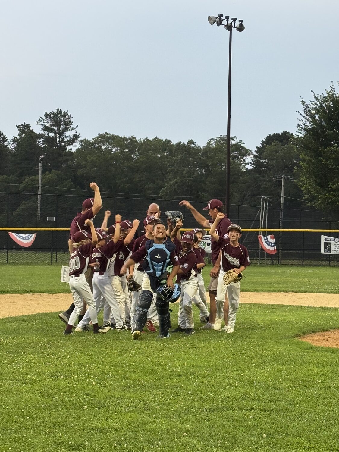 East Hampton's 10U All-Stars celebrate winning the District 36 Championship after their 7-5 victory over Moriches Bay on Tuesday night.   KATE WIRTH