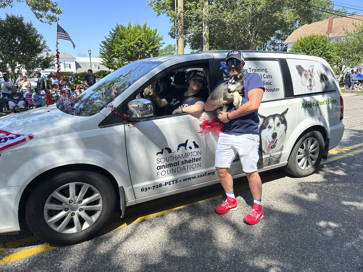 Southampton Animal Shelter Executive Director Christopher Teakle with a Huskie puppy.  GREGORY D'ELIA