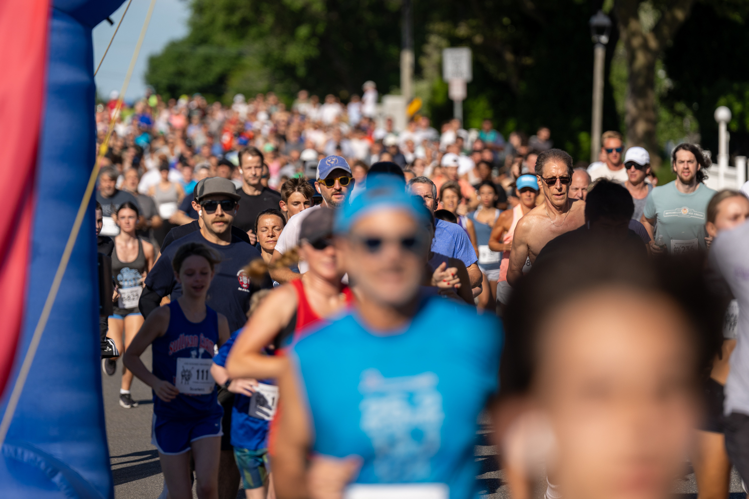 Close to 400 runners and walkers head out for the 33rd live Joe Koziarz Memorial 5K in Westhampton Beach on Saturday morning.  RON ESPOSITO