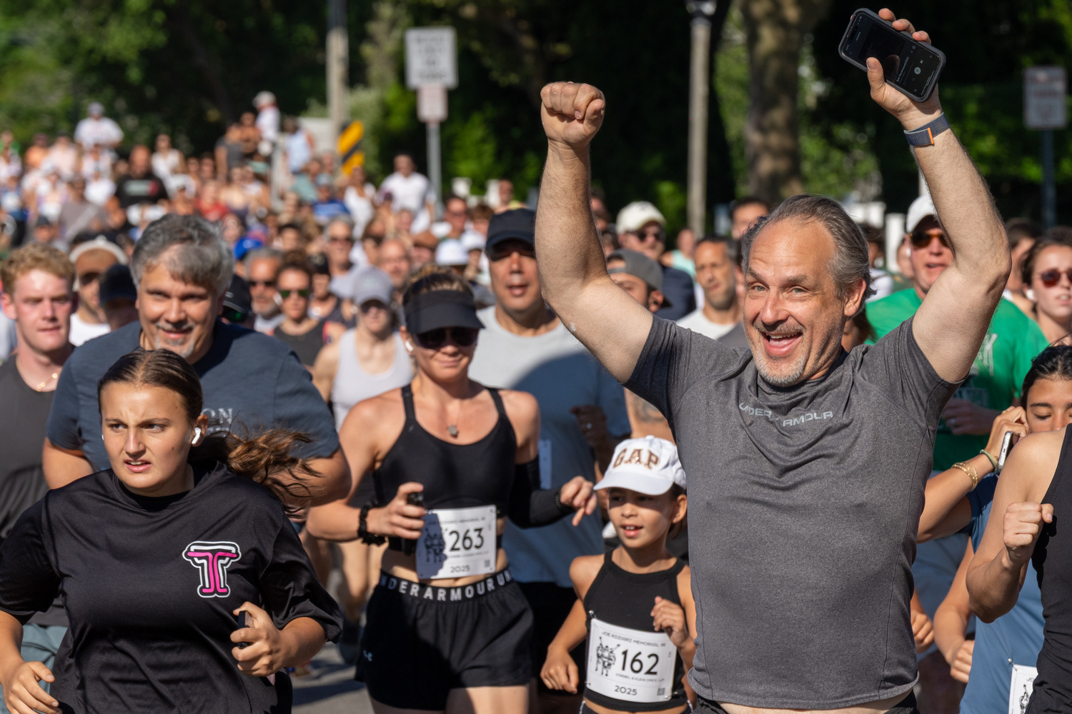 Close to 400 runners and walkers head out for the 33rd live Joe Koziarz Memorial 5K in Westhampton Beach on Saturday morning.  RON ESPOSITO