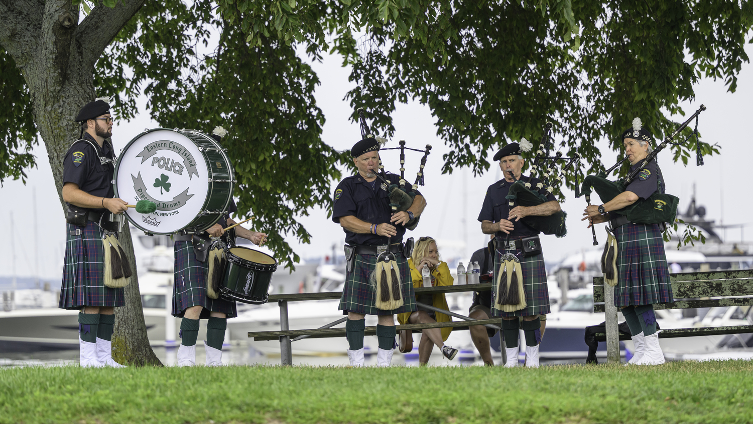 Eastern Long Island Police Pipes and Drums serenade the runners.  MARIANNE BARNETT