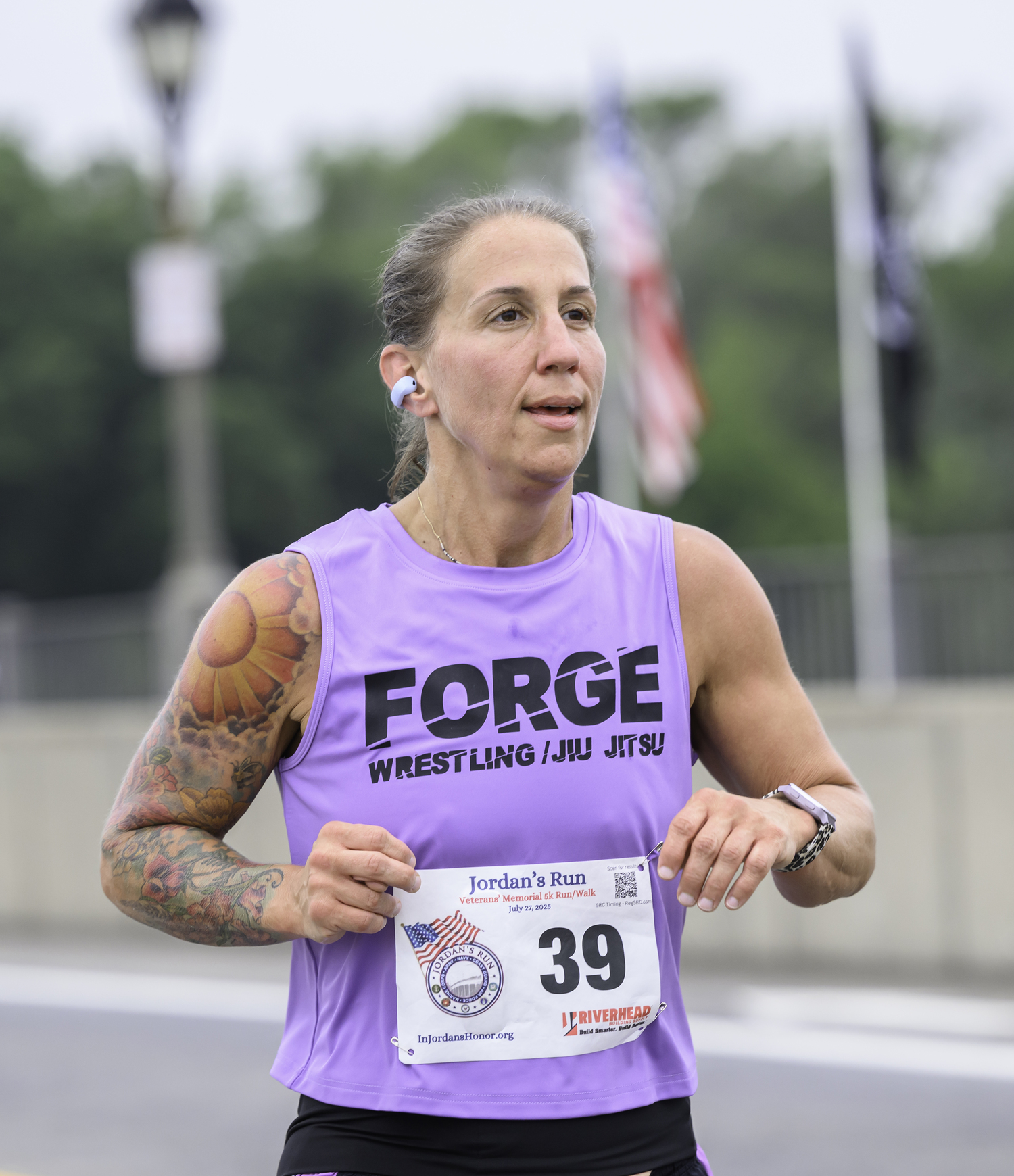 LeighAnn deGroot of Holbrook heads over the Lance Cpl. Jordan Haerter Memorial Bridge.  MARIANNE BARNETT