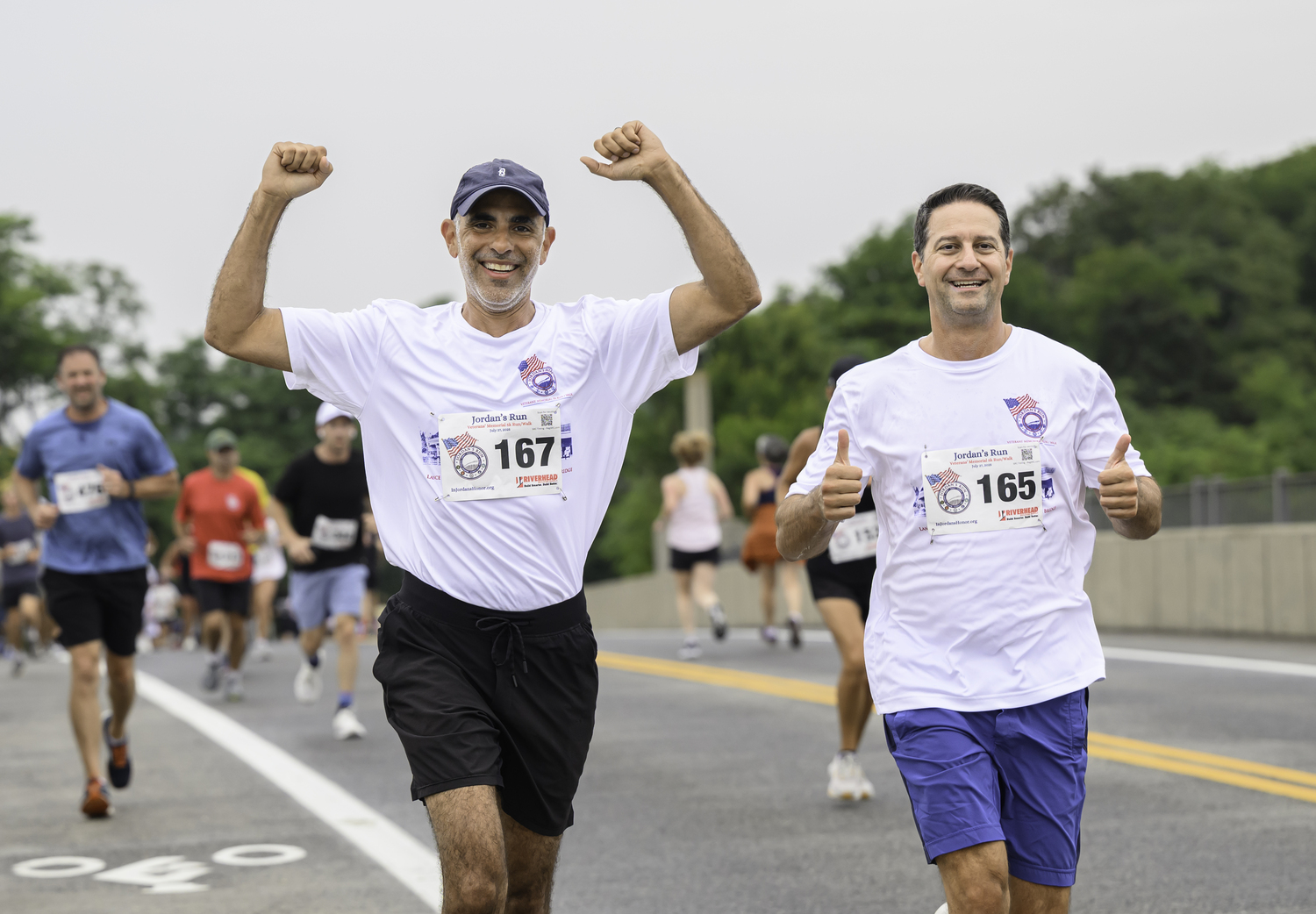 Jason Turowsky, left, and Michael D’Angelo head over the bridge.  MARIANNE BARNETT