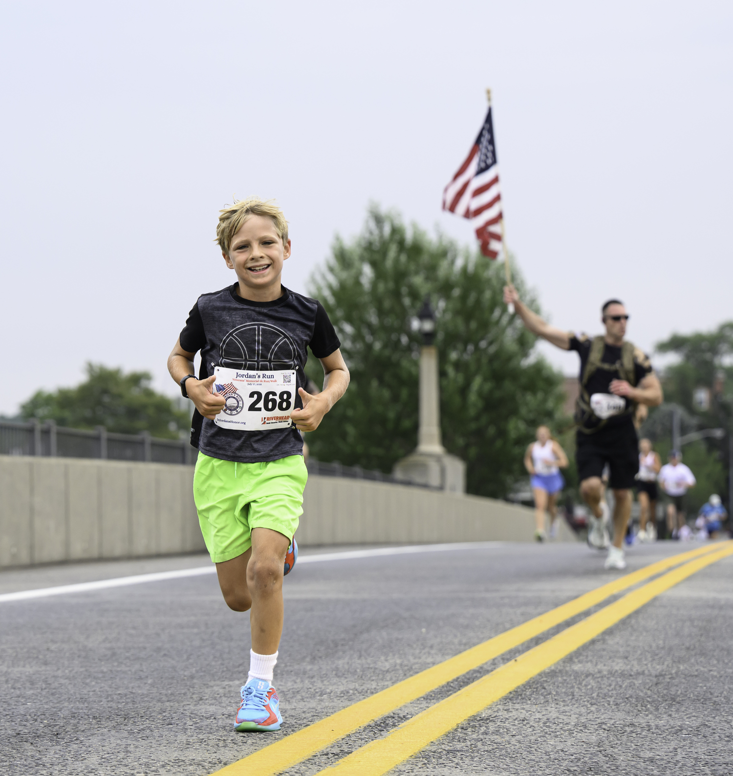 A young Sag Harbor runner heads over the bridge.  MARIANNE BARNETT
