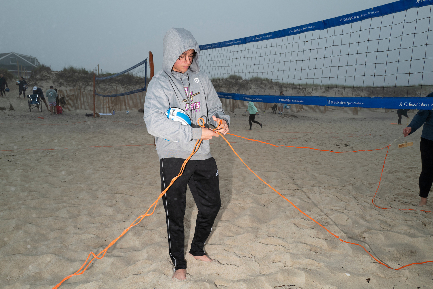 The 12 volleyball courts at Tiana Beach in Hampton Bays are packed on Tuesday and Thursday nights for leagues organized by East End Volleyball, which is on the cusp of its 50th anniversary. LORI HAWKINS