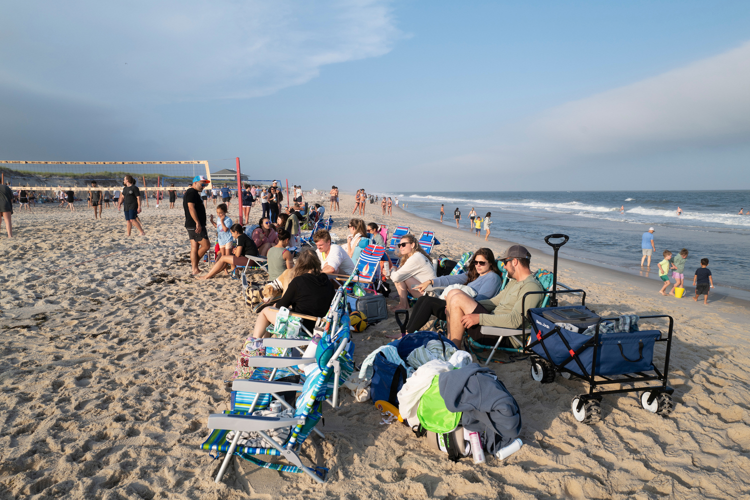 The 12 volleyball courts at Tiana Beach in Hampton Bays are packed on Tuesday and Thursday nights for leagues organized by East End Volleyball, which is on the cusp of its 50th anniversary. LORI HAWKINS