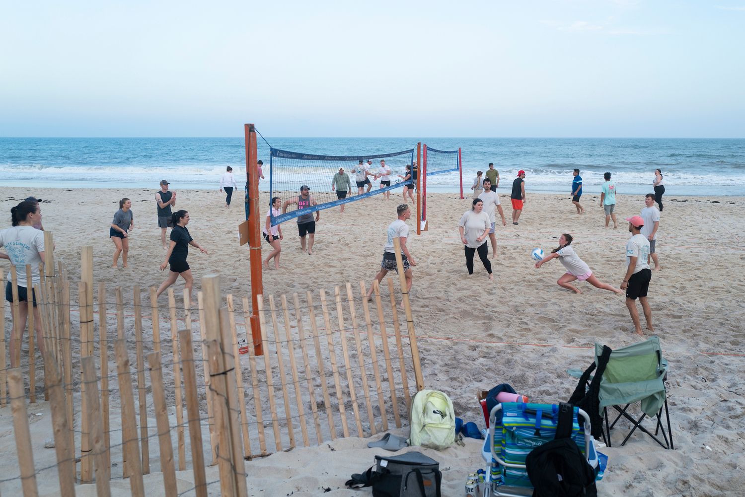 The 12 volleyball courts at Tiana Beach in Hampton Bays are packed on Tuesday and Thursday nights for leagues organized by East End Volleyball, which is on the cusp of its 50th anniversary. LORI HAWKINS