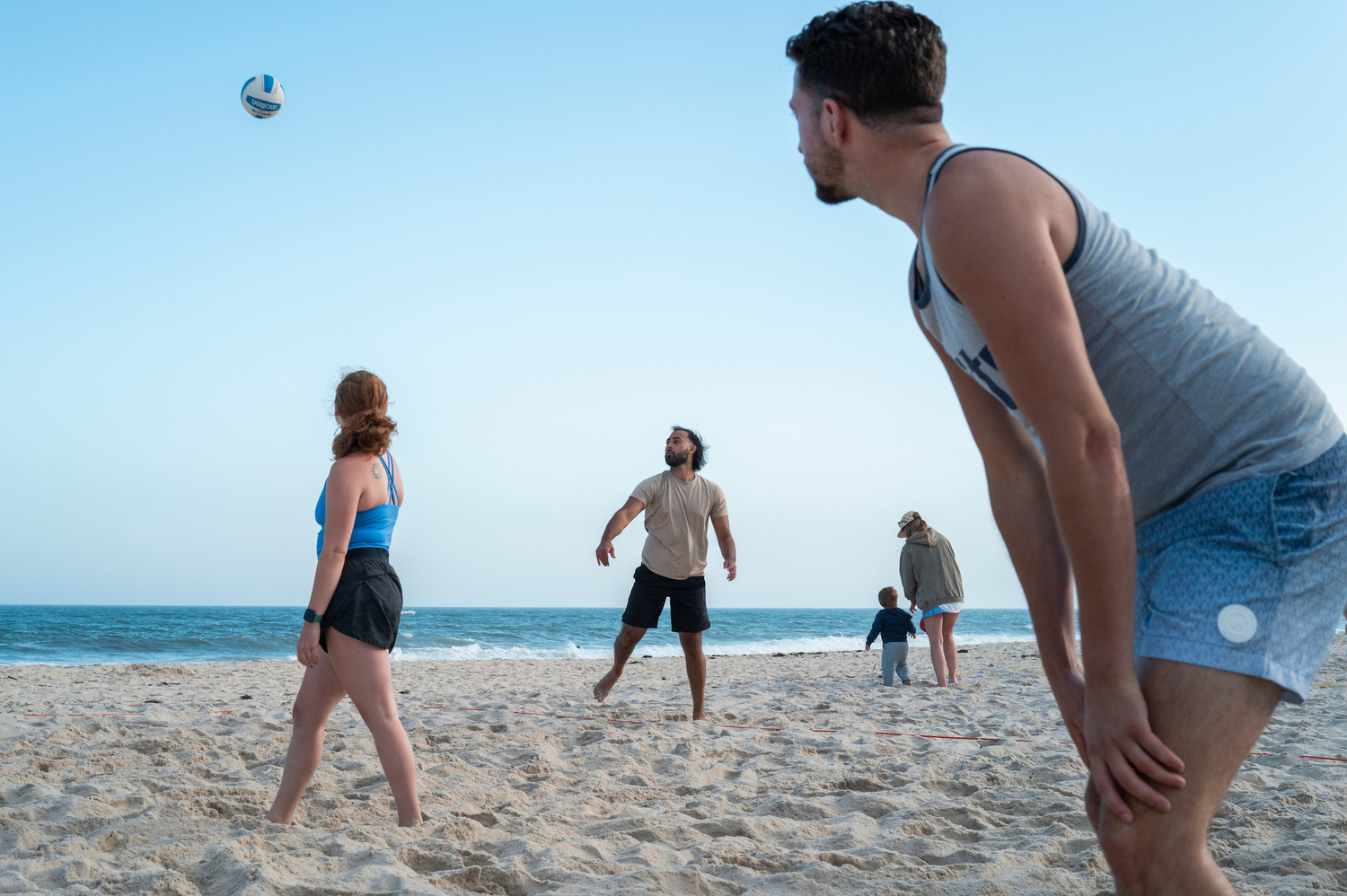 The 12 volleyball courts at Tiana Beach in Hampton Bays are packed on Tuesday and Thursday nights for leagues organized by East End Volleyball, which is on the cusp of its 50th anniversary. LORI HAWKINS