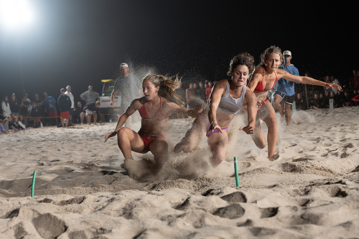East Hampton Town lifeguard Amanda Calabrese is the first to the beach flag.  RON ESPOSITO