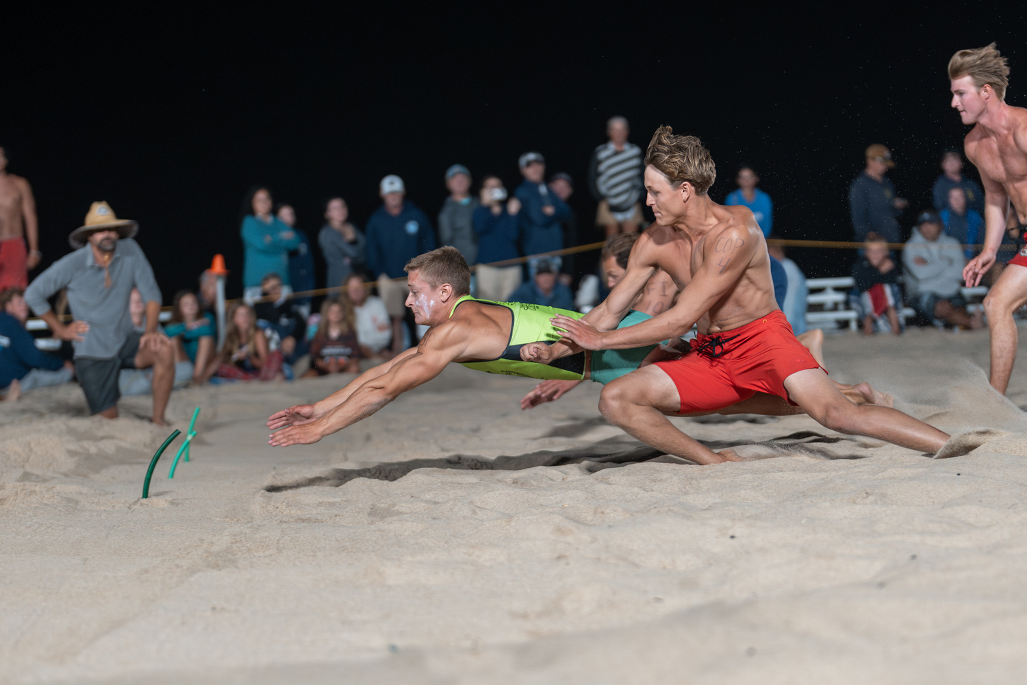 Smith Point lifeguard Matthew Kotch reaches out to beat Coopers Beach lifeguard Hudson Fox to the beach flag.  RON ESPOSITO