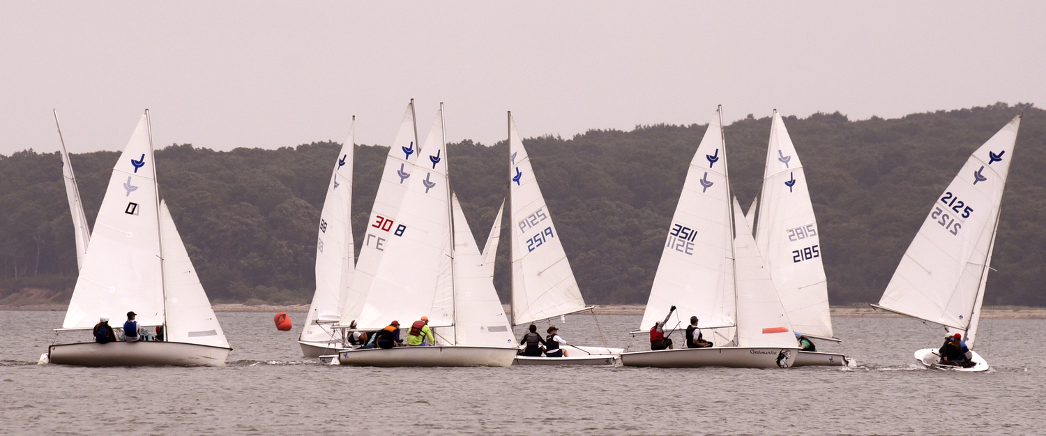 A close-quarters mark rounding with Venetia Satow and crew William Bateman (sail #2519), center stage.  MICHAEL MELLA