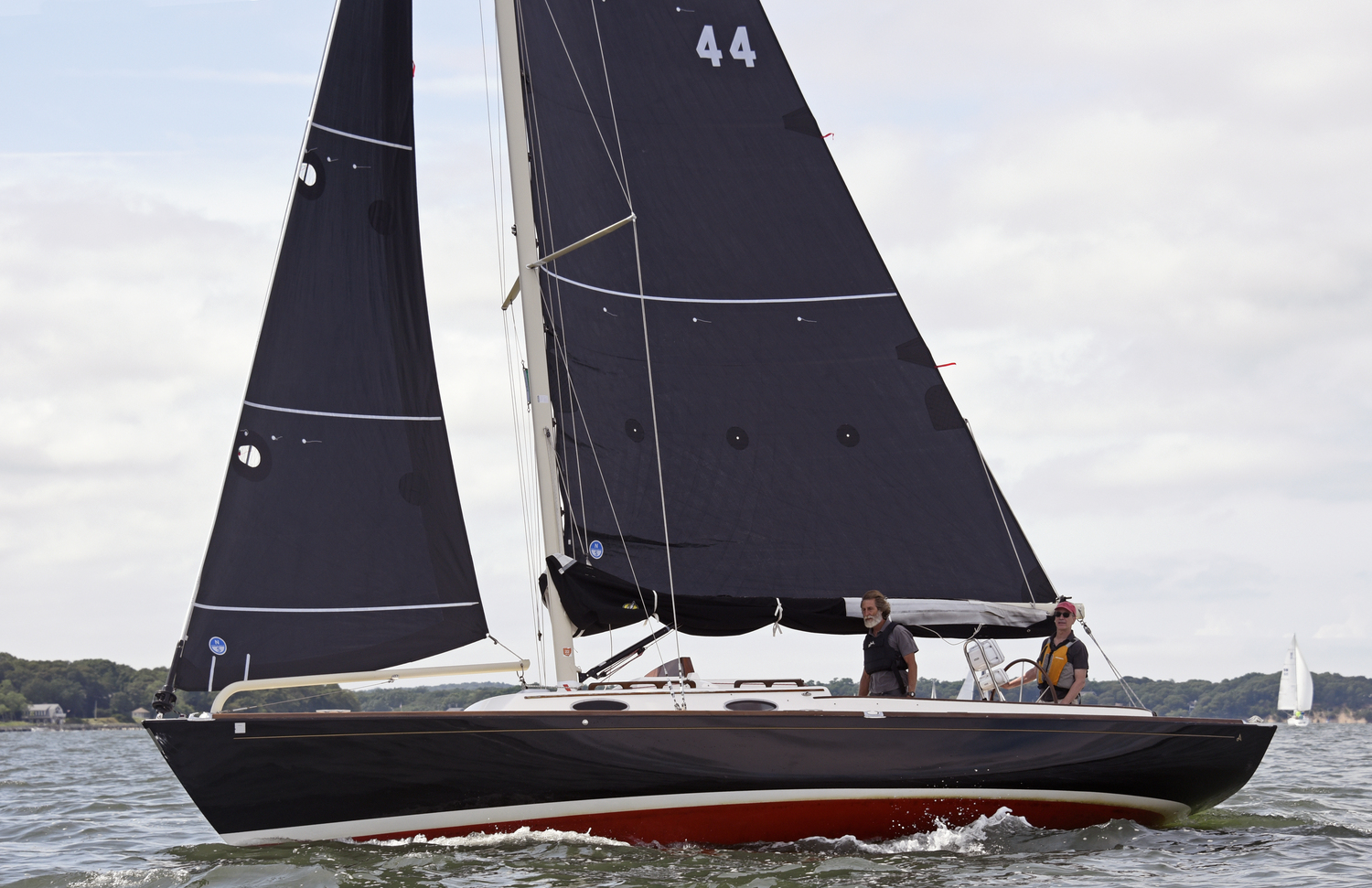 Second place in the newly added “Club Class,” James Merrell at the wheel of his Alerion 33 Beautiful Necessity with sole crew, Derrick Galen.  MICHAEL MELLA