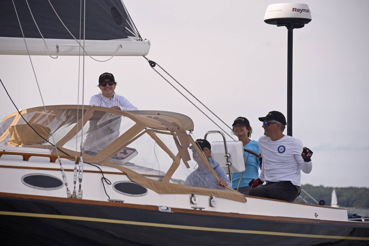 “Club Class” winner Beth Van der Eems at the wheel of her Alerion Express 38 Osprey moments after crossing the finish line.  MICHAEL MELLA