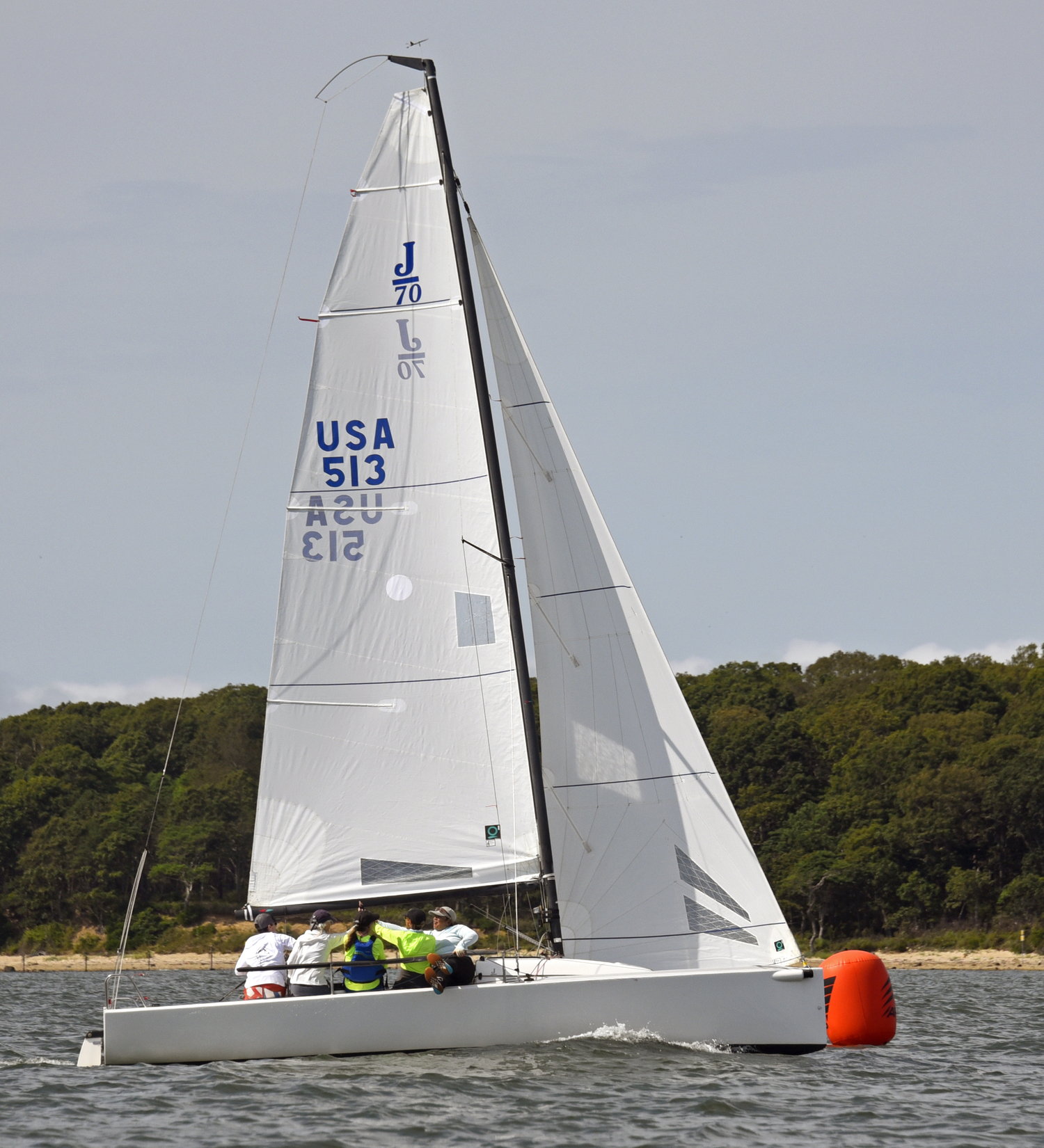 High fives aboard Breakwater’s “all women” J-70 as she crosses the finish line!  MICHAEL MELLA