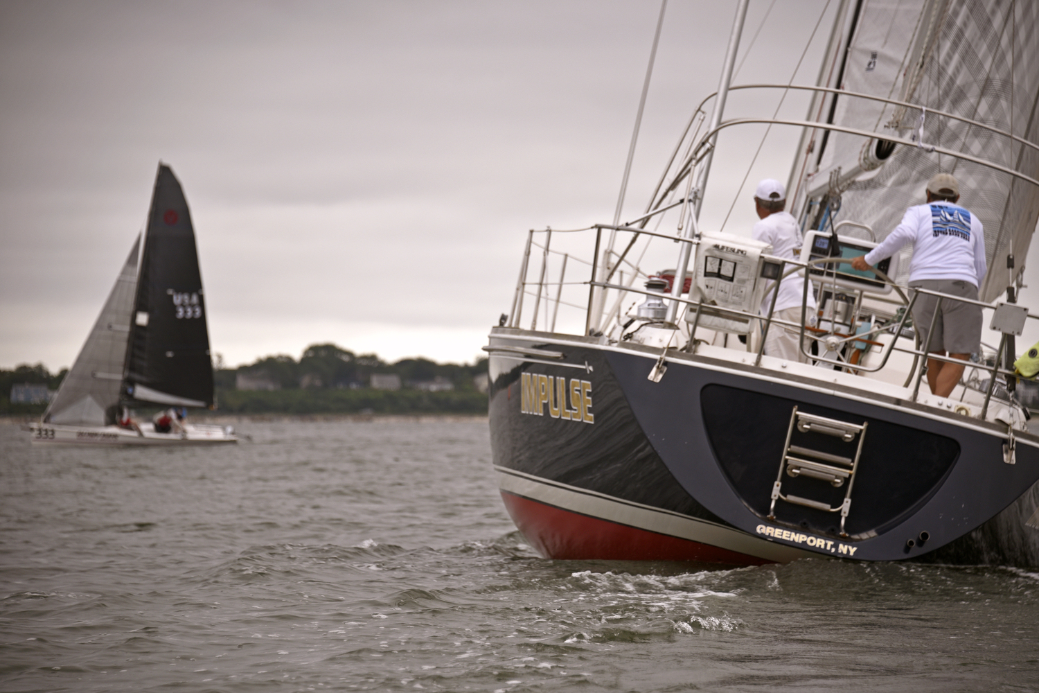 Andrew Baris at the wheel of his Sabre 402 Impulse staying clear of overall winner Peter Beardsley on his Viper 640 Glory Days. Size takes a bow to the fastest boat in this year’s fleet!  MICHAEL MELLA