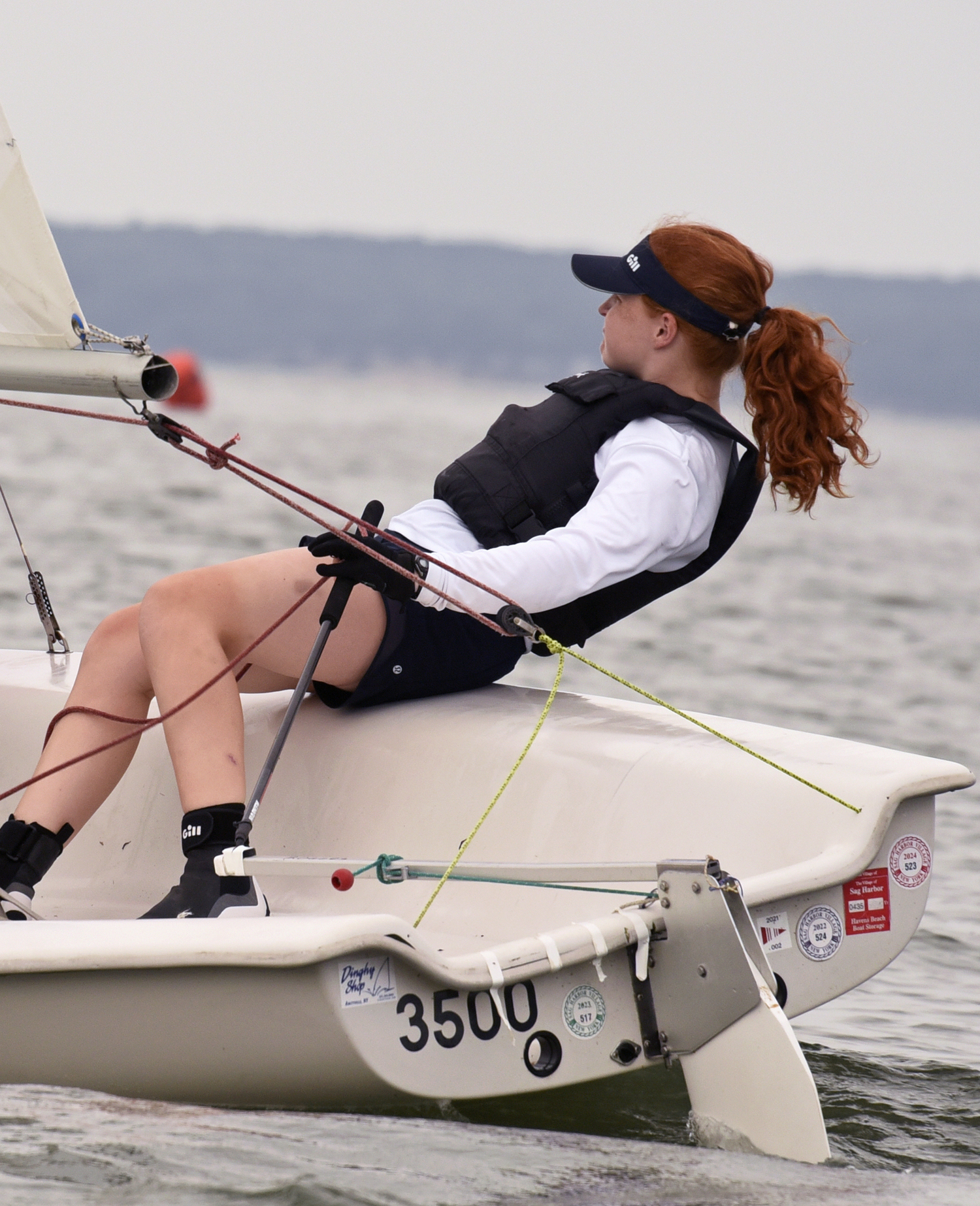 Breakwater’s 18 year-old wunderkind Venetia Satow, shown here at last year's race, with William Bateman on the jib, having scored “bullets” in three out of six races put them in first place by a huge margin. Most of her competitors have been sailing since they were young kids; Venetia started just three years ago. She has packed a decade of aggressive sailboat training and racing into those three years. Her current regimen is five days a week, being coached by two collegiate sailors at the Shelter Island Yacht Club. Keep an eye on Venetia, an Olympics-bound gal!  MICHAEL MELLA