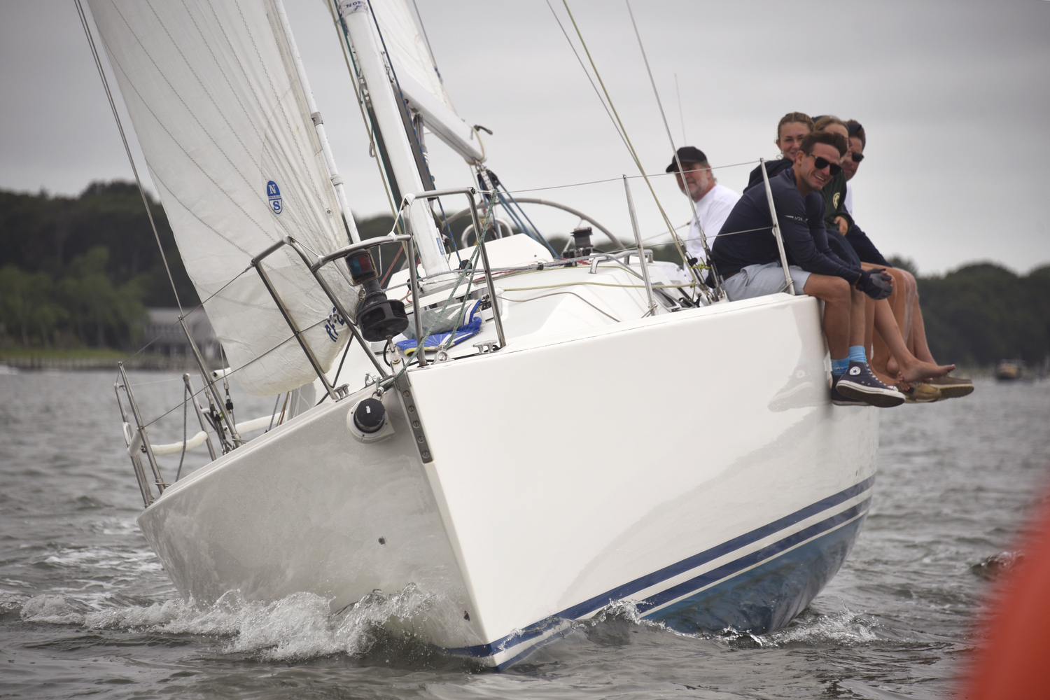 Steve Kenny’s Gossip rules the bay! The J-109 was awarded first place in Division 1 and second place in the three combined divisions. All smiles are de rigueur which translates: “the formula to win!” Yes, the boat I was shooting from made a quick turn after this 1/2000 of a second exposure!  MICHAEL MELLA
