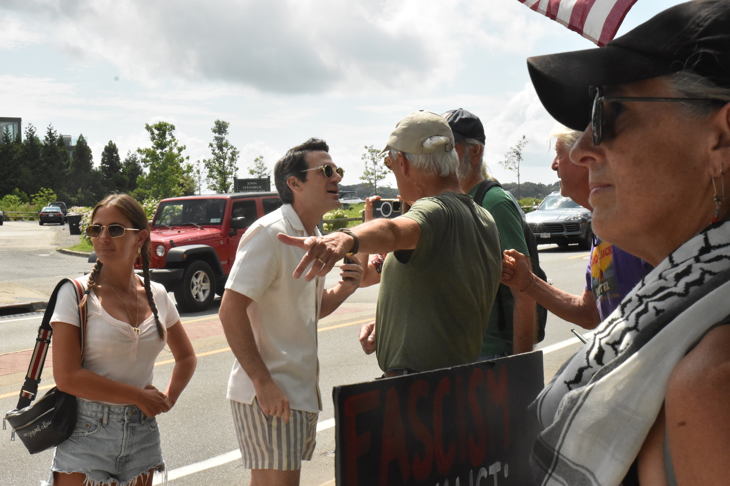 Two supporters of Israel had words with members of a group holding a vigil for a ceasefire in Gaza on Sunday in Sag Harbor. STEPHEN J. KOTZ