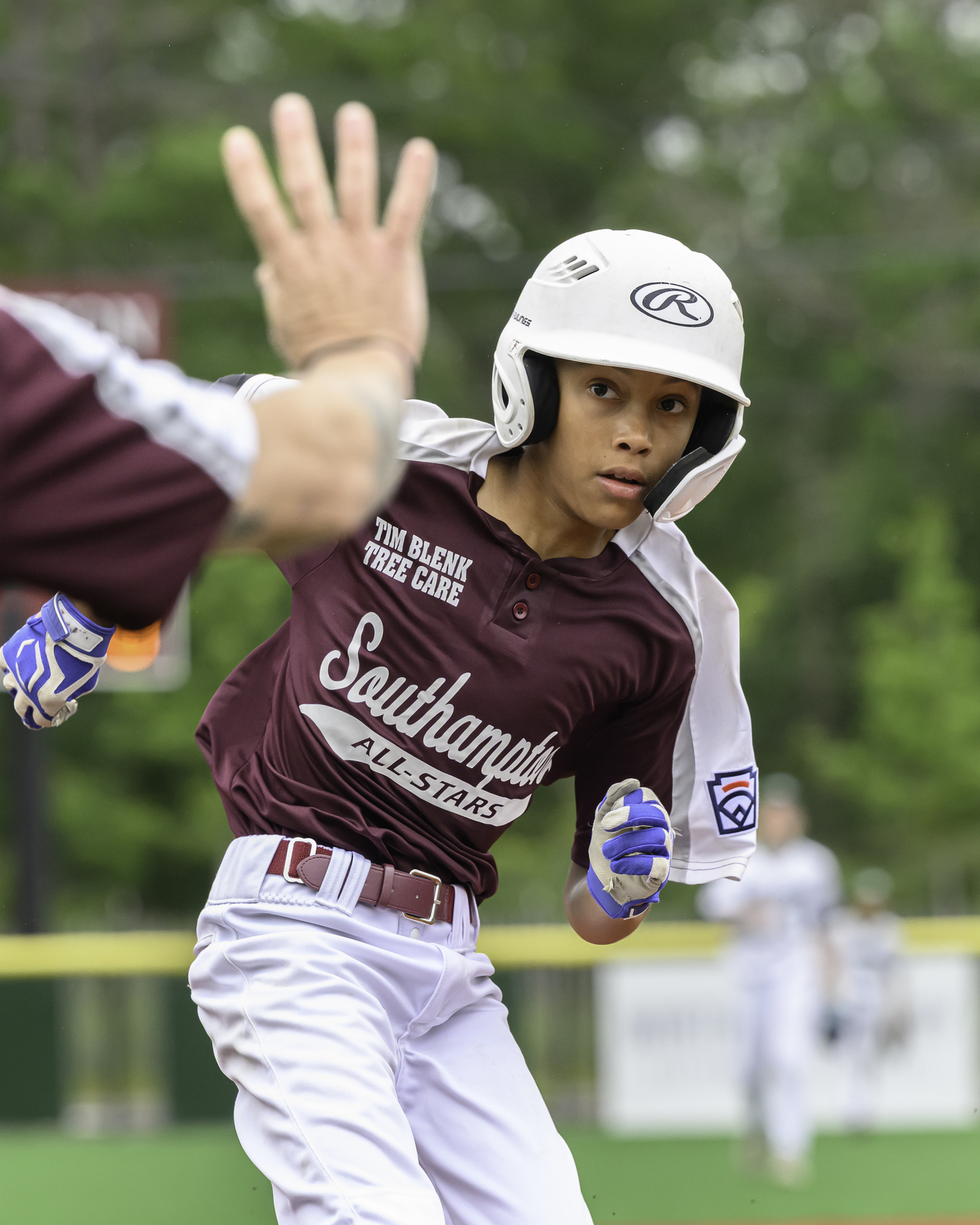 Donovan Lee gets the hold sign from his third base coach.  MARIANNE BARNETT