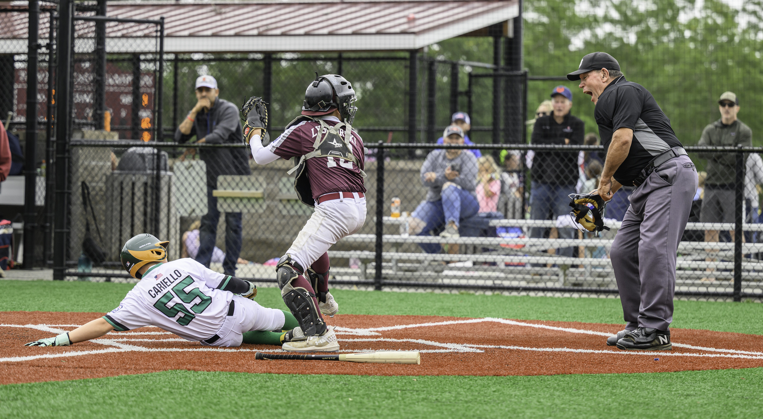 Southampton catcher Nash Lysogorski tags out East End's Ben Cariello.  MARIANNE BARNETT