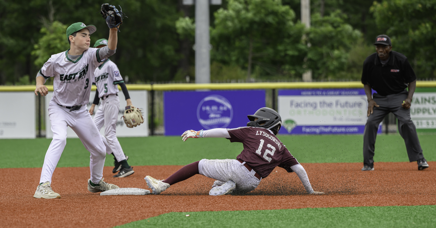 Southampton’s Nash Lysogorski slides into second base.  MARIANNE BARNETT