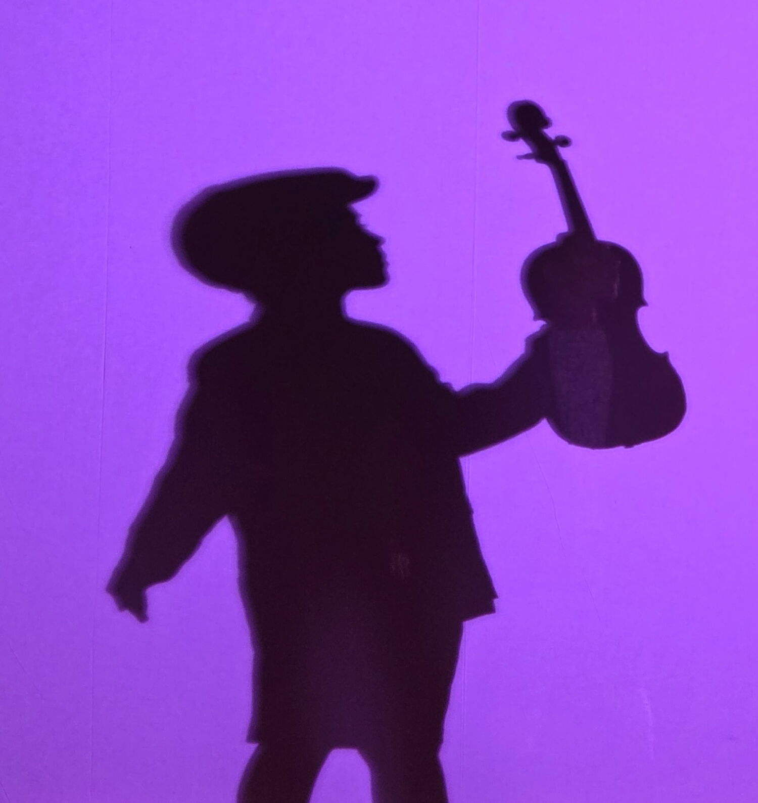 Nine year-old Natali Leon appears as the Soldier when he was a boy in a scene created Park Avenue Chamber Symphony's performance of Igor Stravinsky’s “The Soldier’s Tale.” The show, which uses extensive theatrical lighting and shadow puppetry, will be presented by Shelter Island Friends of Music on August 3. ADAM BUNDY