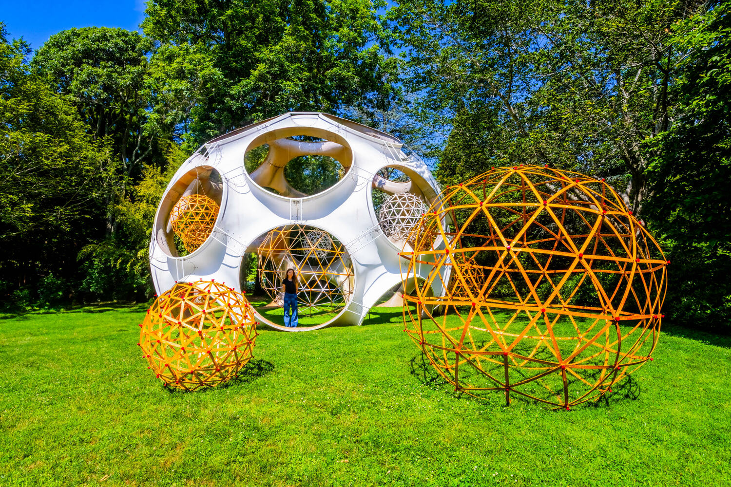 Alice Hope with her work “True Value,” which a direct response to LongHouse Reserve’s iconic Buckminster Fuller-inspired geodesic dome. The installation is built from True Value yardsticks and remains on view at LongHouse through October. PHILLIPPE CHENG