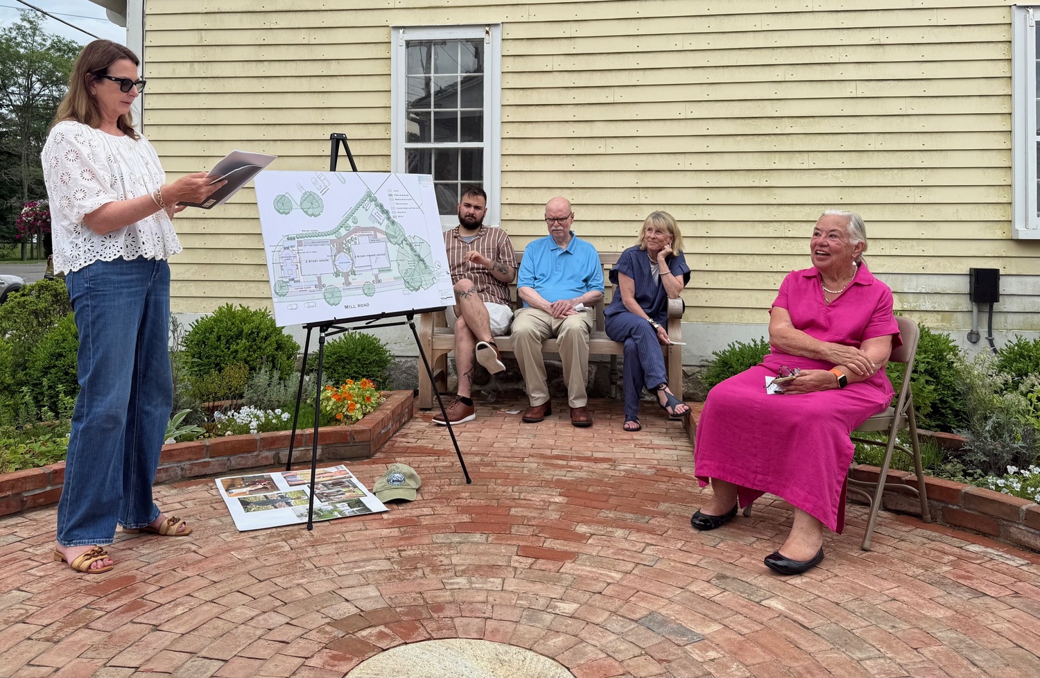 Greater Westhampton Historical Museum President Bo Bishop formally opened the period gardens designed and developed by the Westhampton Garden Club  with a Garden Tea Party on July 10. WGC's Ruth Ann Rosenthal led a committee of fellow members on the three year project to complement the 1790s Foster Meeker House and the 1840 Tuttle House. Both  were moved to Westhampton Village property at 101 Mill Road. The collaborative effort with the museum received additional support from Todd Scates, owner of Landscape Solutions, who installed the brickwork, and the Village of Westhampton for the irrigation installation and permanent use of the land.
At the opening Westhampton Garden Club  President Alicia Whitaker spoke of the many donors who contributed money, time and materials to the project and building improvements, as well as a grant from  the Robert David Lion Gardiner Foundation.