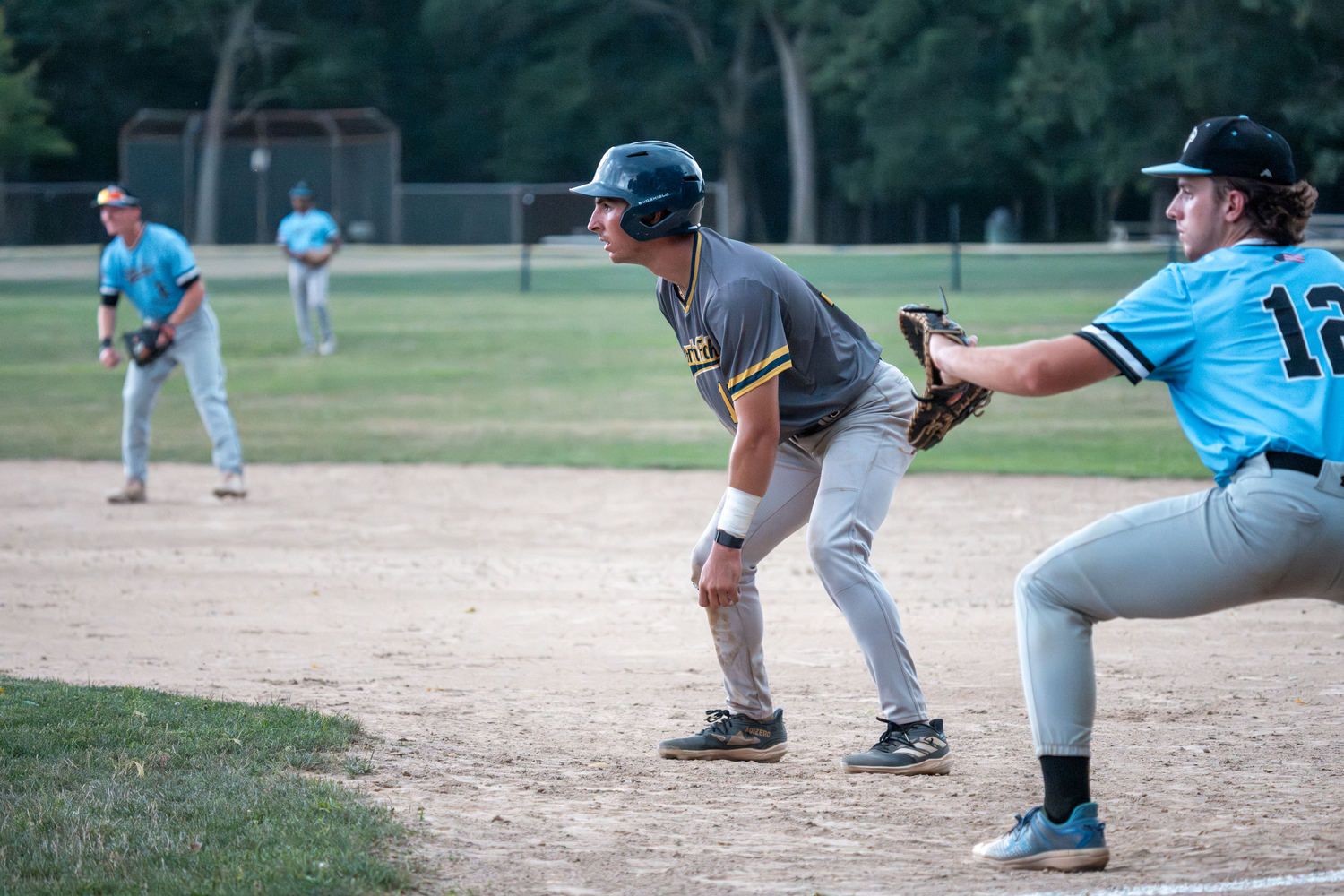 A North Fork play leads off of first base.  RON ESPOSITO