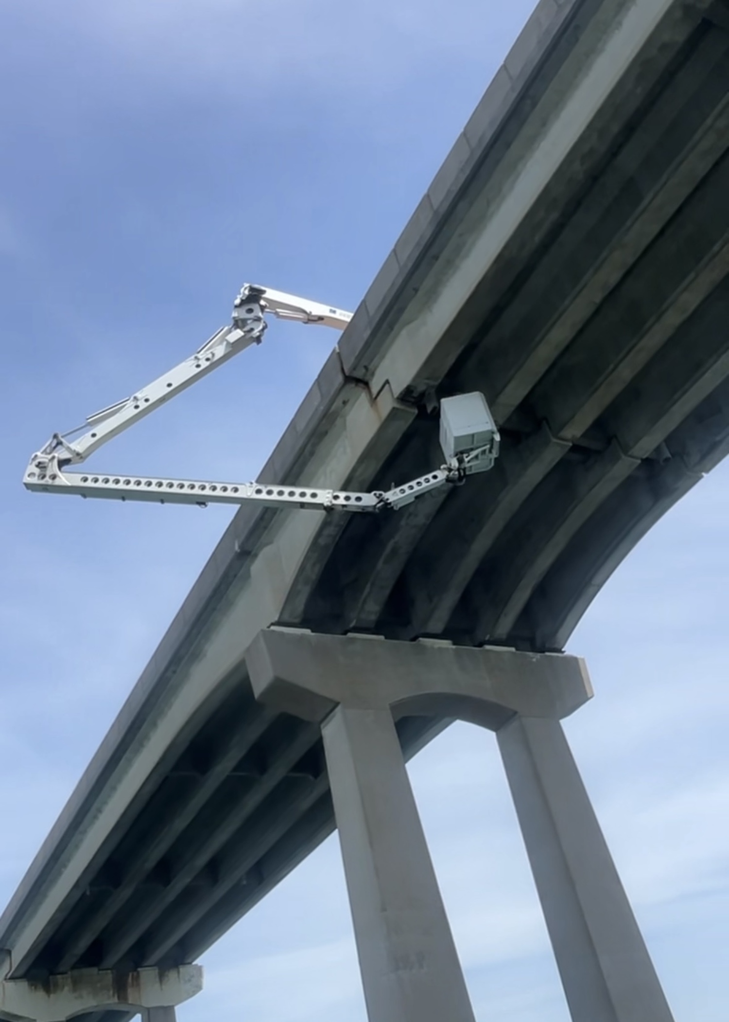 Engineers will use an under-bridge inspection truck to conduct extensive new analysis of the deterioration of concrete in the Ponquogue Bridge over the next two weeks. CAPT. BRAD RIES