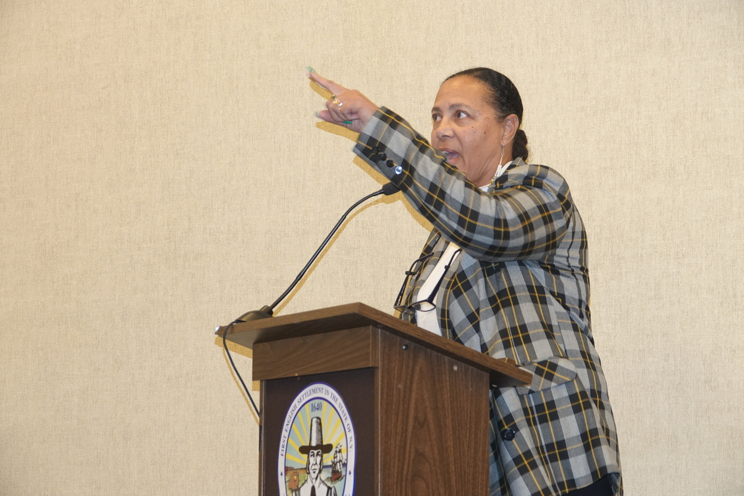 Shinnecock Chairwoman Lisa Goree pointed angrily to the nation's seal in Town Hall back in December, after the town proposed suing to stop the Shinnecock from building a gas station, and said the town should remove the seal if it saw the tribe's members as adversaries not constituents. MICHAEL WRIGHT