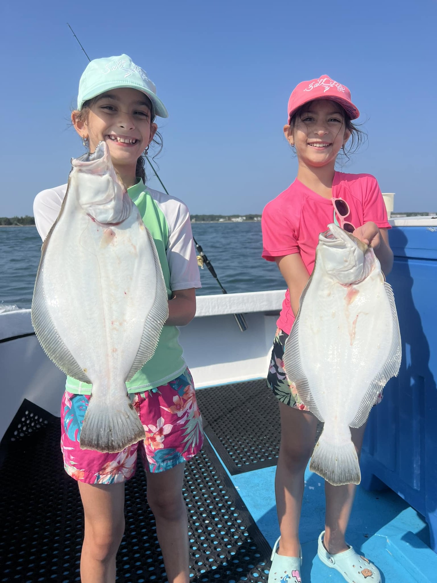 Young anglers are enjoying the last days of the summer fishing season before they head back to school. Luckily for these tykes, the fluke bite inside Shinnecock Bay stayed good while the swell from Hurricane Erin had the ocean stirred up. COURTESY HAMPTON LADY FISHING