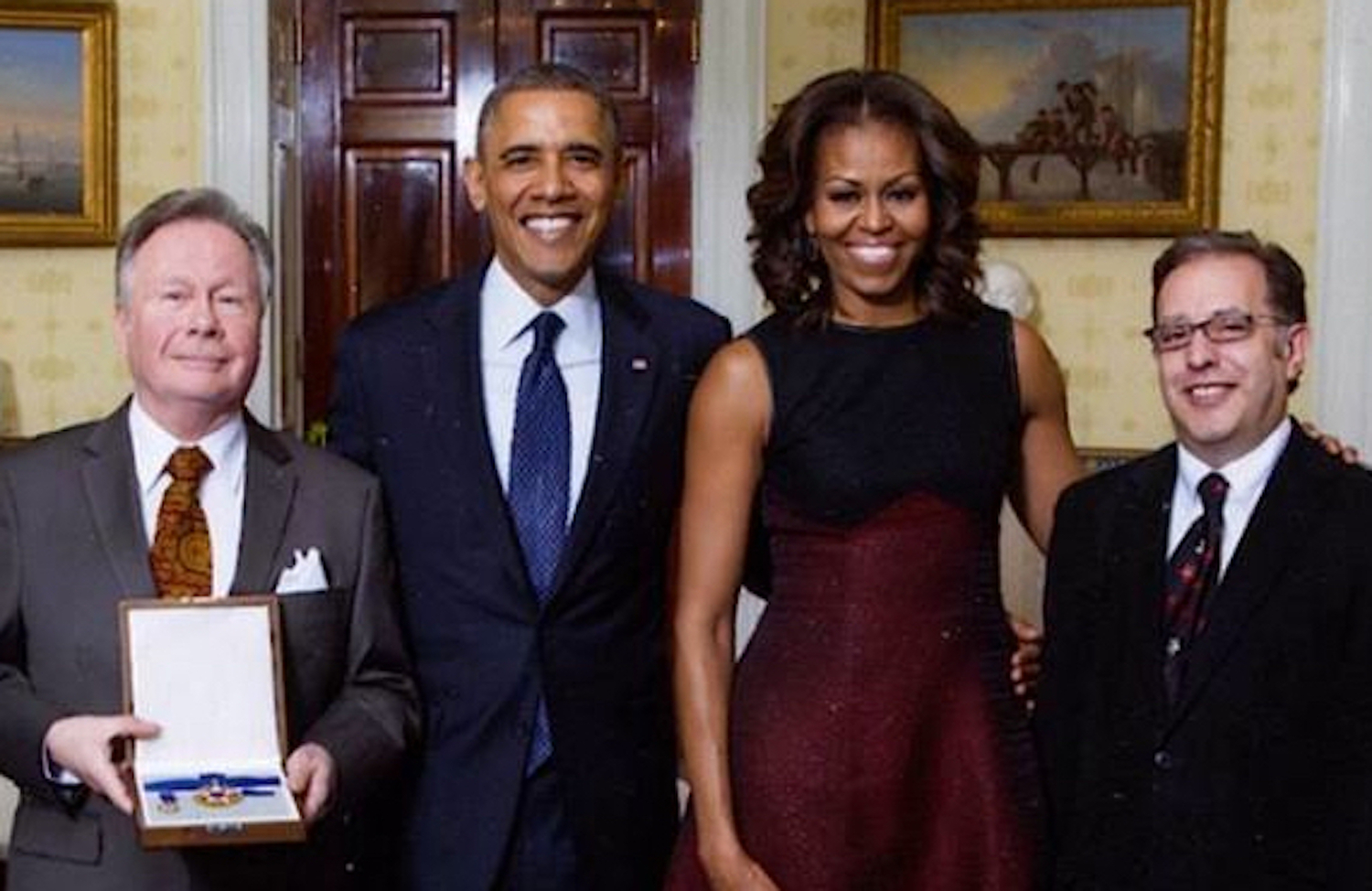 Walter Naegle, Barack Obama, Michelle Obama, and Bennett Singer at 2013 Medal of Freedom Ceremony. Naegle, who was Bayard Rustin’s life partner, accepted the Presidential Medal of Freedom that President Obama awarded posthumously to Rustin at a White House ceremony on November 20, 2013. PUBLIC DOMAIN