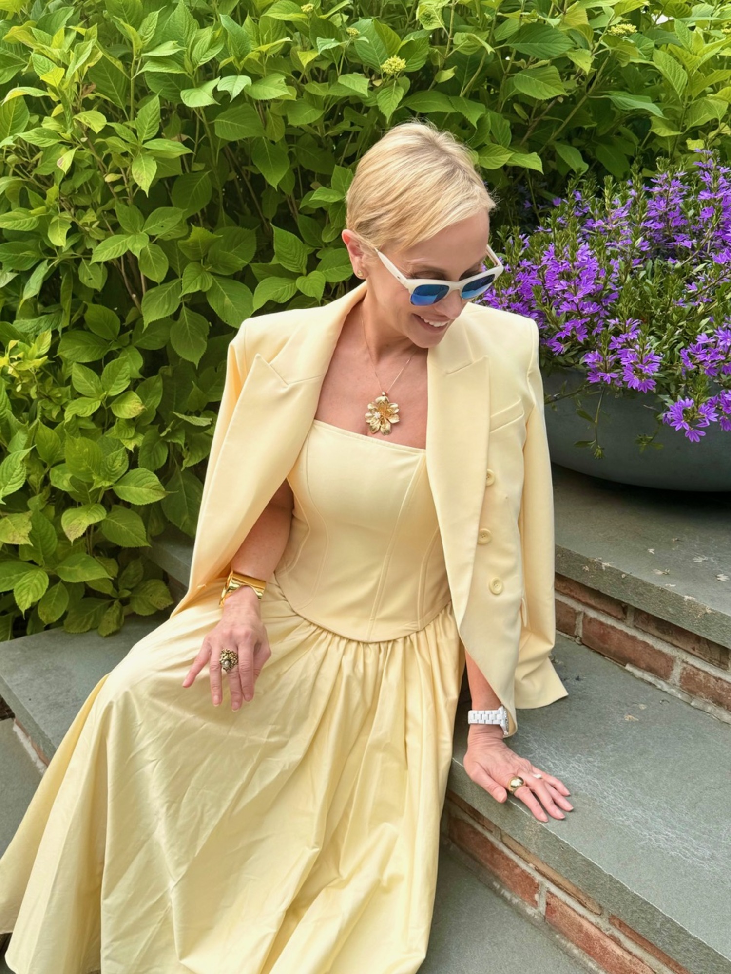 Lisa Frohlich in a butter yellow look by Toccin. Adding a blazer over a dress is a perfect transition to fall.