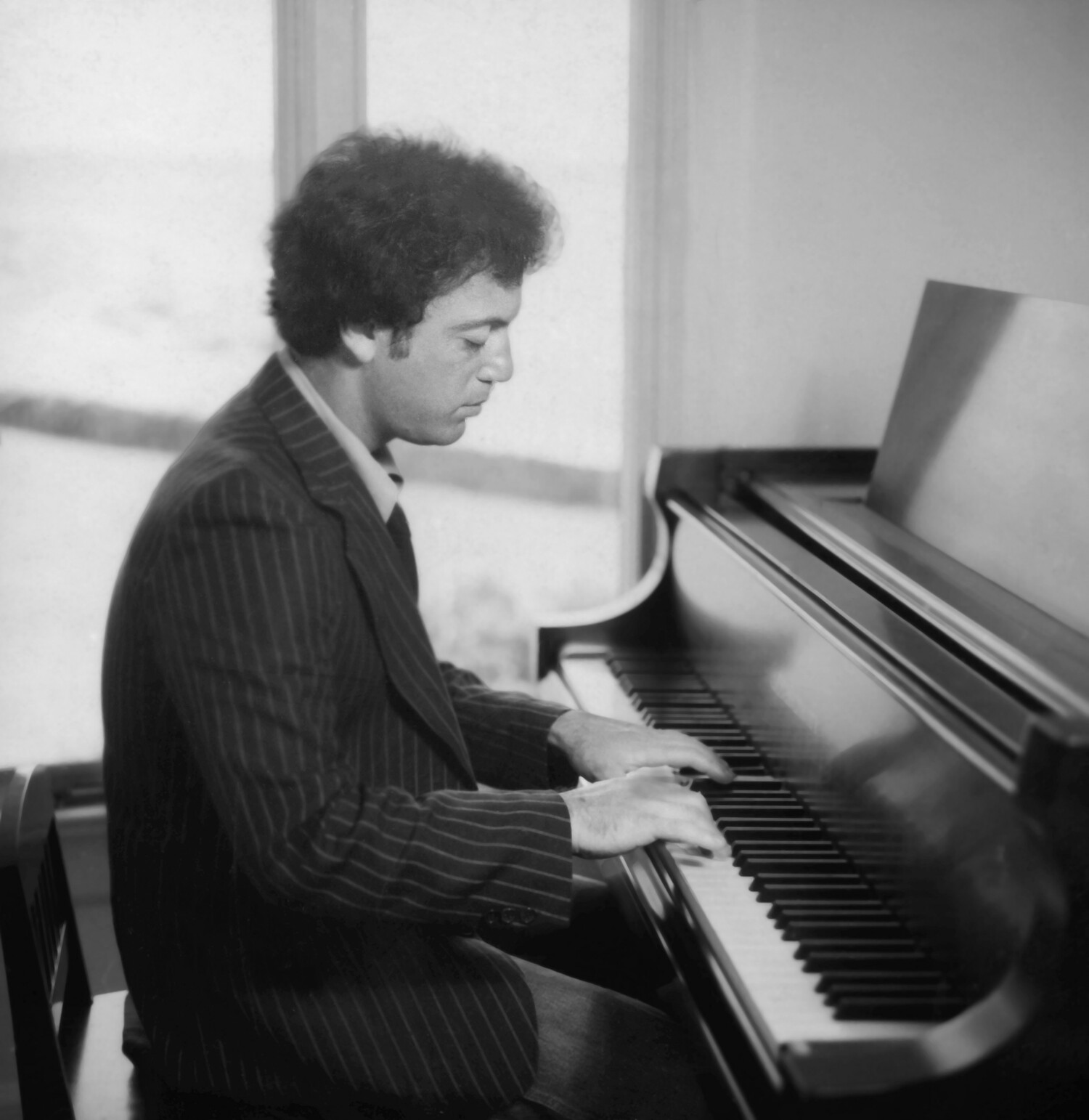 Billy Joel at the piano in a scene from the HBO documentary “Billy Joel: And So It Goes.” BILLY JOEL ARCHIVES/DAN WEEKS