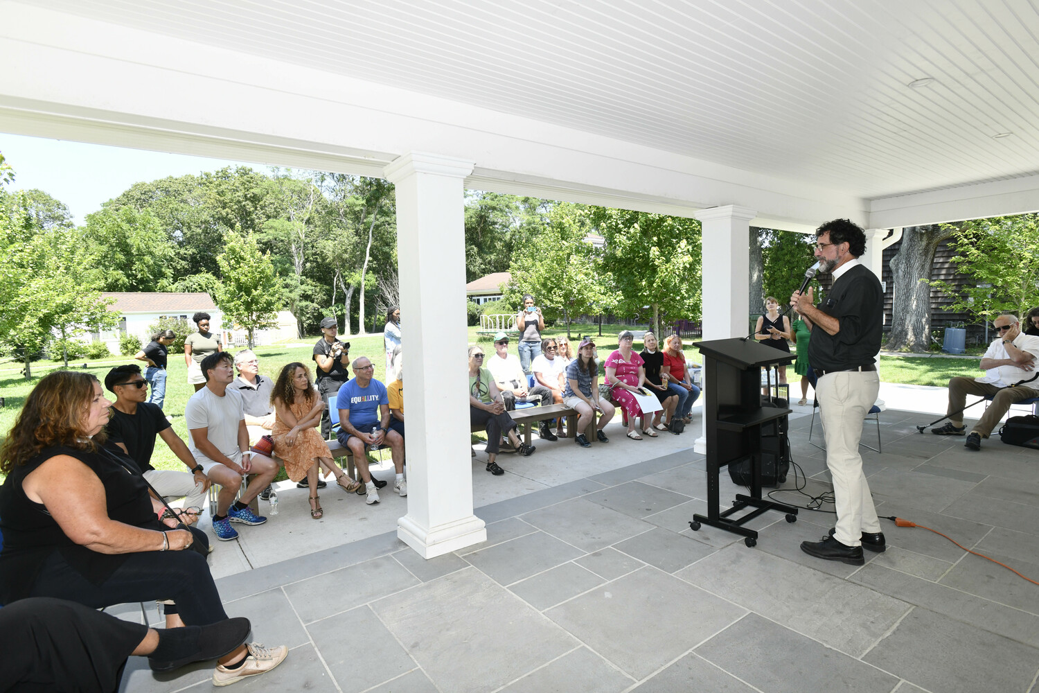 Reverend Richard Witt of Rural & Migrant Ministry speaks at the vigil at the Bridgehampton Child Care & Recreation Center on Saturday as part of the 