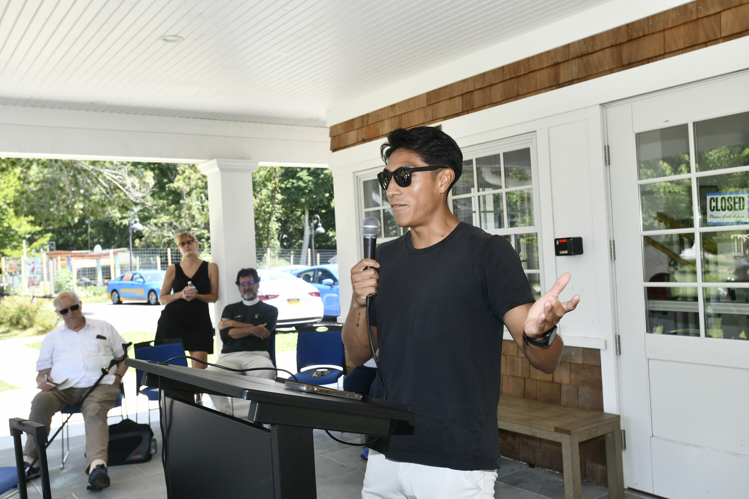 Jon Lopez, Youth Connect Intervention Advocate at OLA Easter Long Island speaks at the vigil at the Bridgehampton Child Care & Recreation Center on Saturday as part of the 