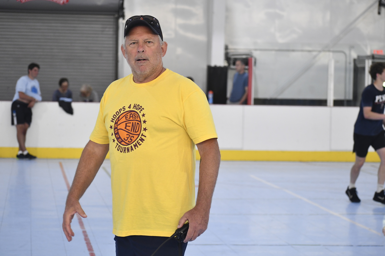 Hoops 4 Hope cofounder Anthony Allison helps direct things on Saturday.  DREW BUDD