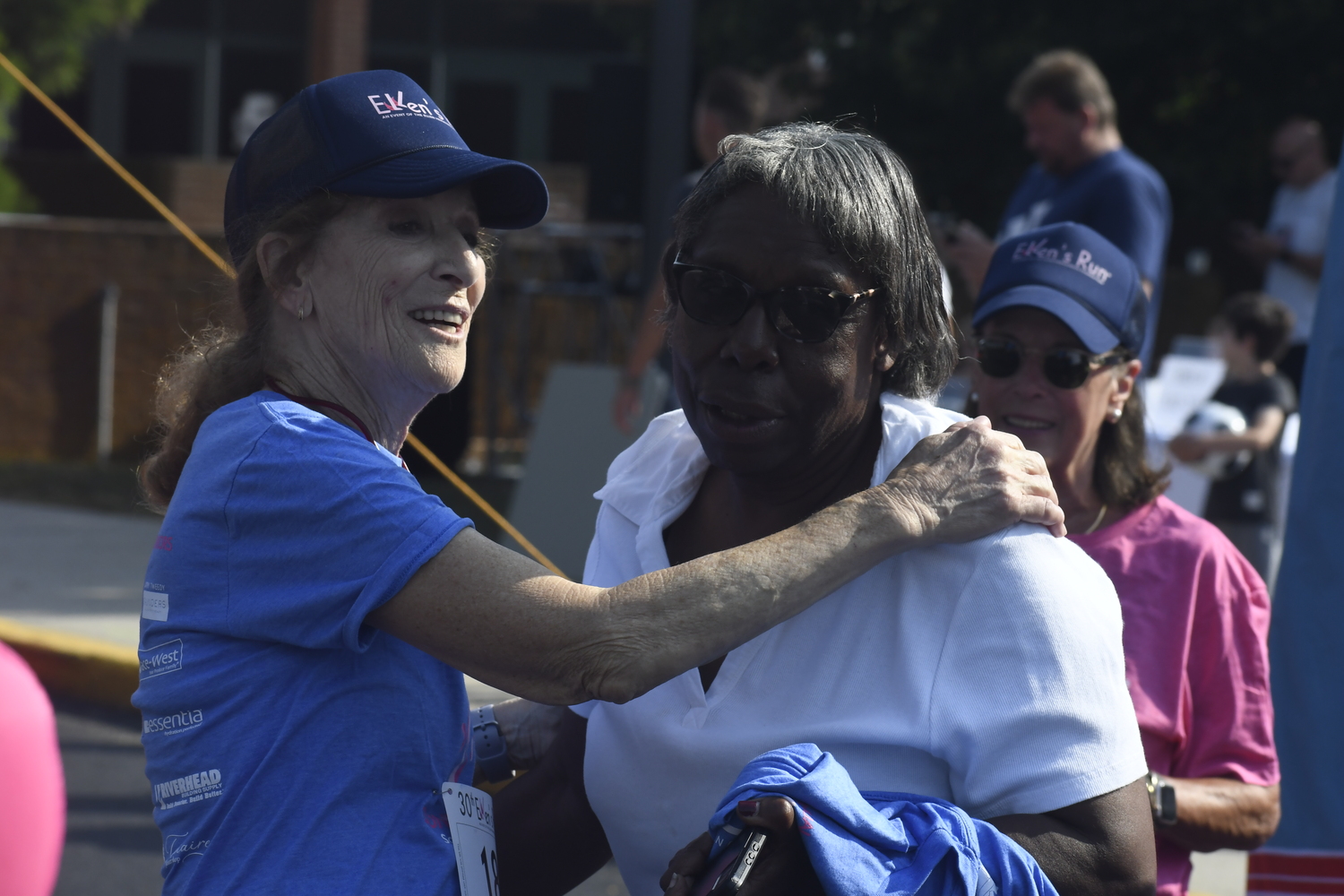 Julie Ratner, left, gets a big hug from Sharon Bacon.  DREW BUDD