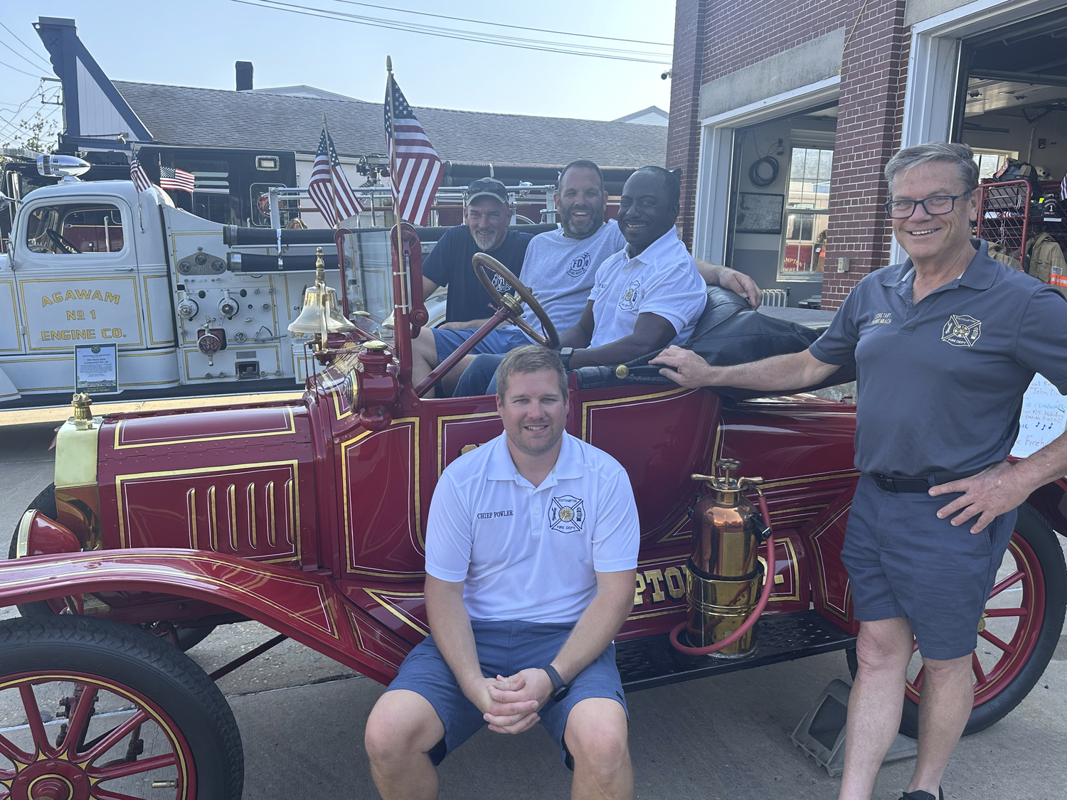 Chief Ricky Fowler, Jim Frankenbach foreground, John Reister, Eric Halsey and Chief Polis Walker at the Chicken and Ribs dinner.   GREGORY D'ELIA