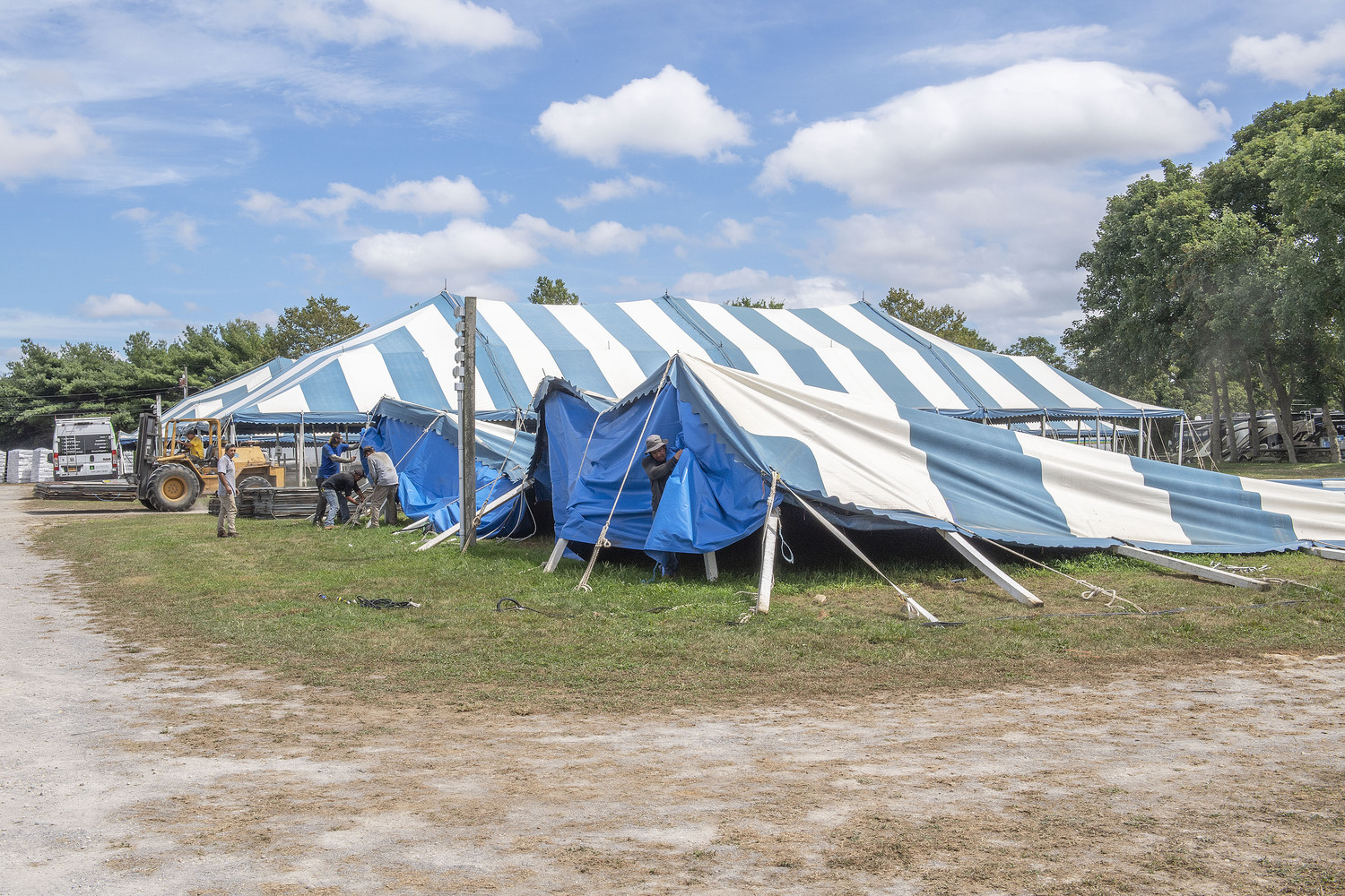 With the approach of Hurricane Henri, ground crews at the Hampton classic take down the large stable-tents on Friday, August 20th, 2021.   FILE PHOTO