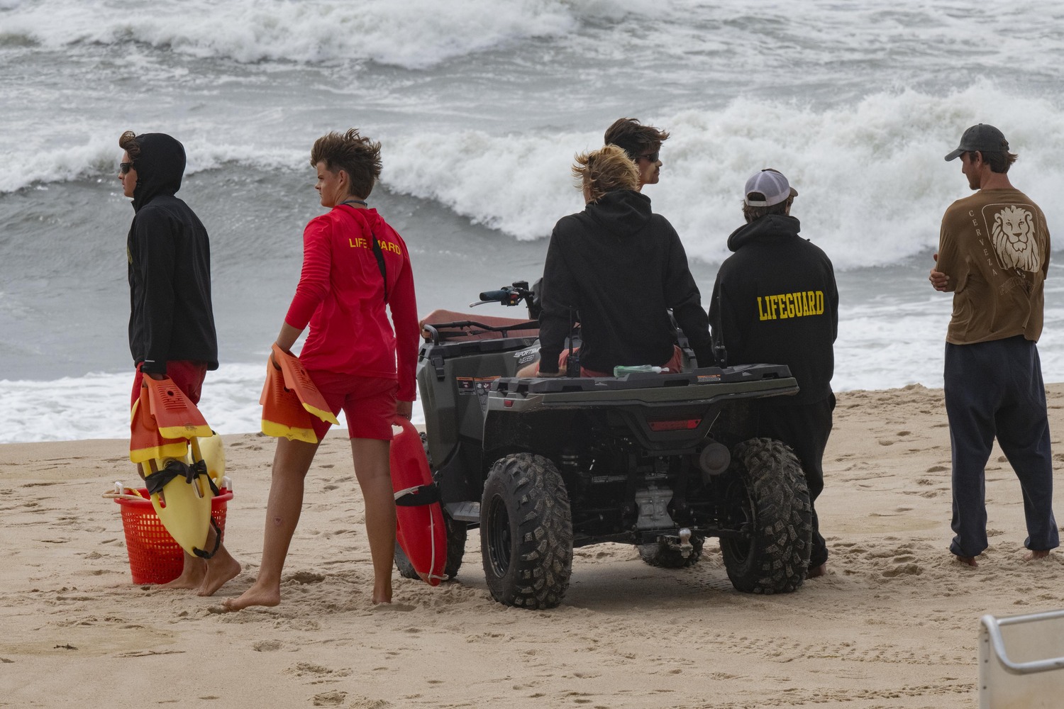 Lifeguards at East Hampton Main Beach make sure everyone stays out of the water in East Hampton before the ocean beaches were closed to  pedestrian traffic on August 20.      DOUG KUNTZ