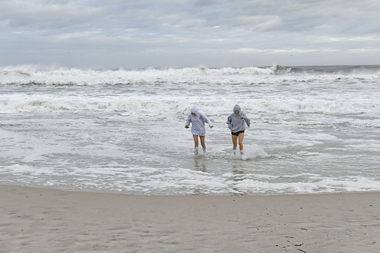 Spectators flocked to Ponquogue Beach in Hampton Bays on August 21 to watch the tide come in as the remnants of Hurricane Erin come through.  DANA SHAW
