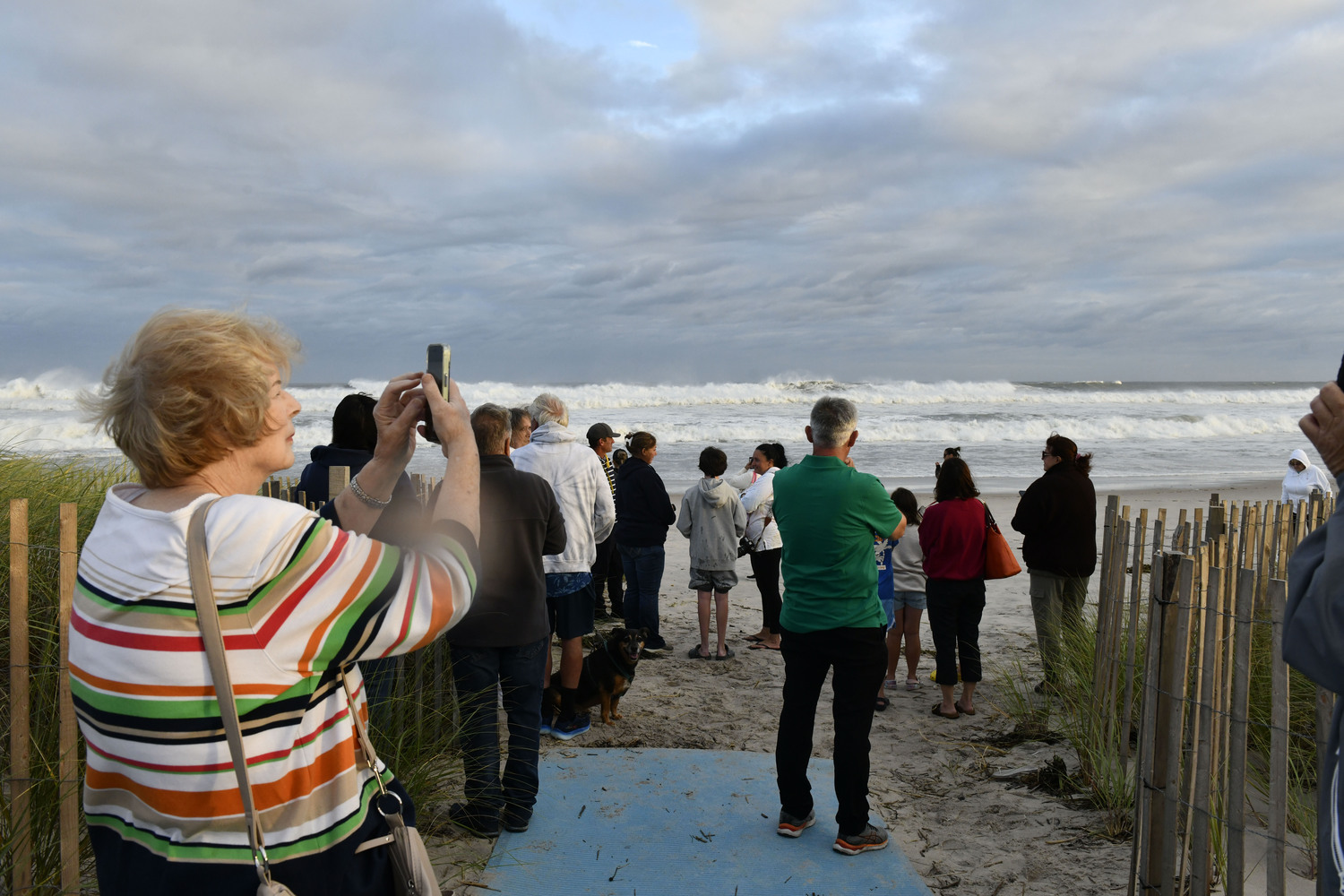 Spectators flocked to Ponquogue Beach in Hampton Bays on August 21 to watch the tide come in as the remnants of Hurricane Erin come through.  DANA SHAW