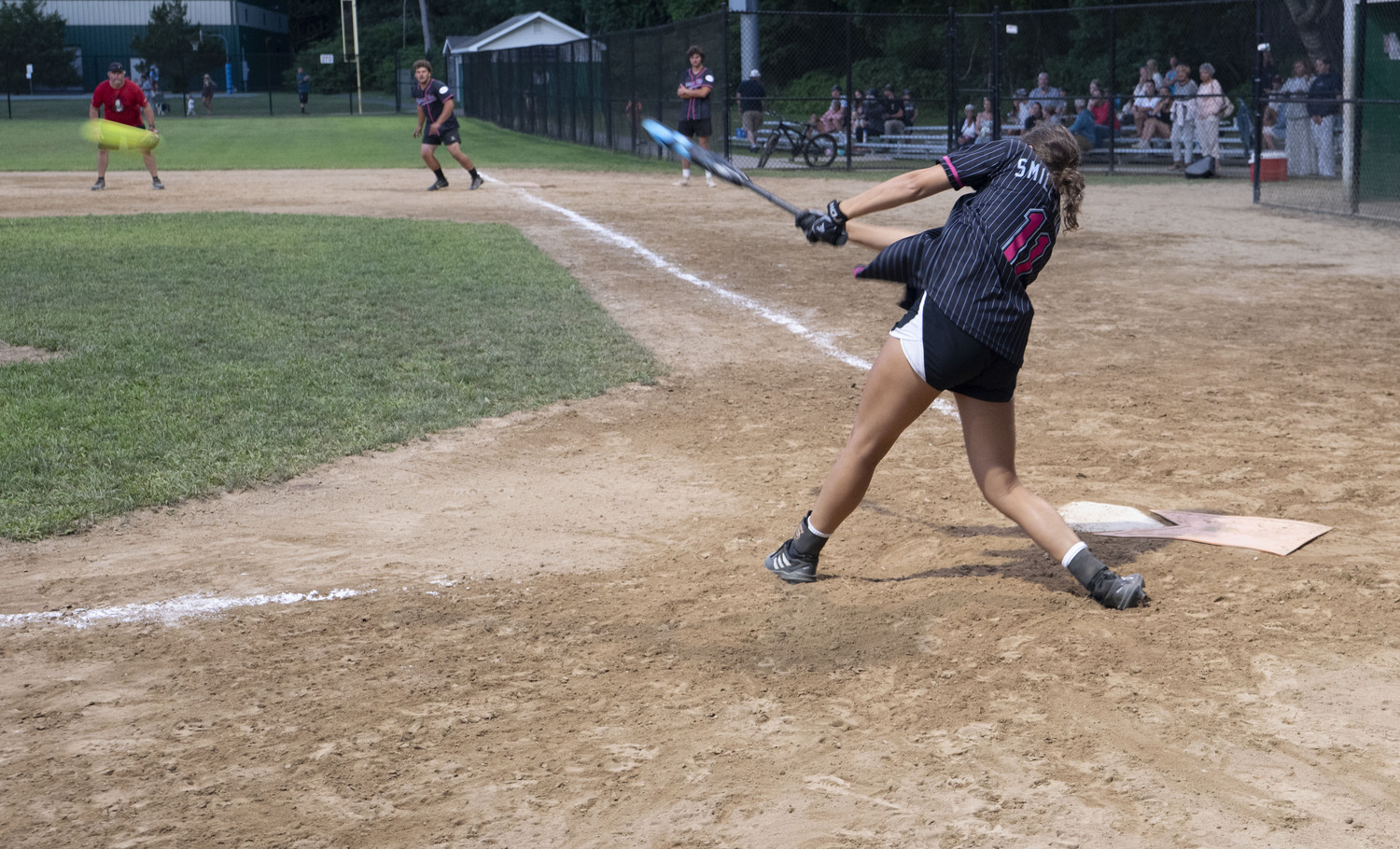 A Bonac Vice player puts a ball in play during the championship game.   DOUG KUNTZ