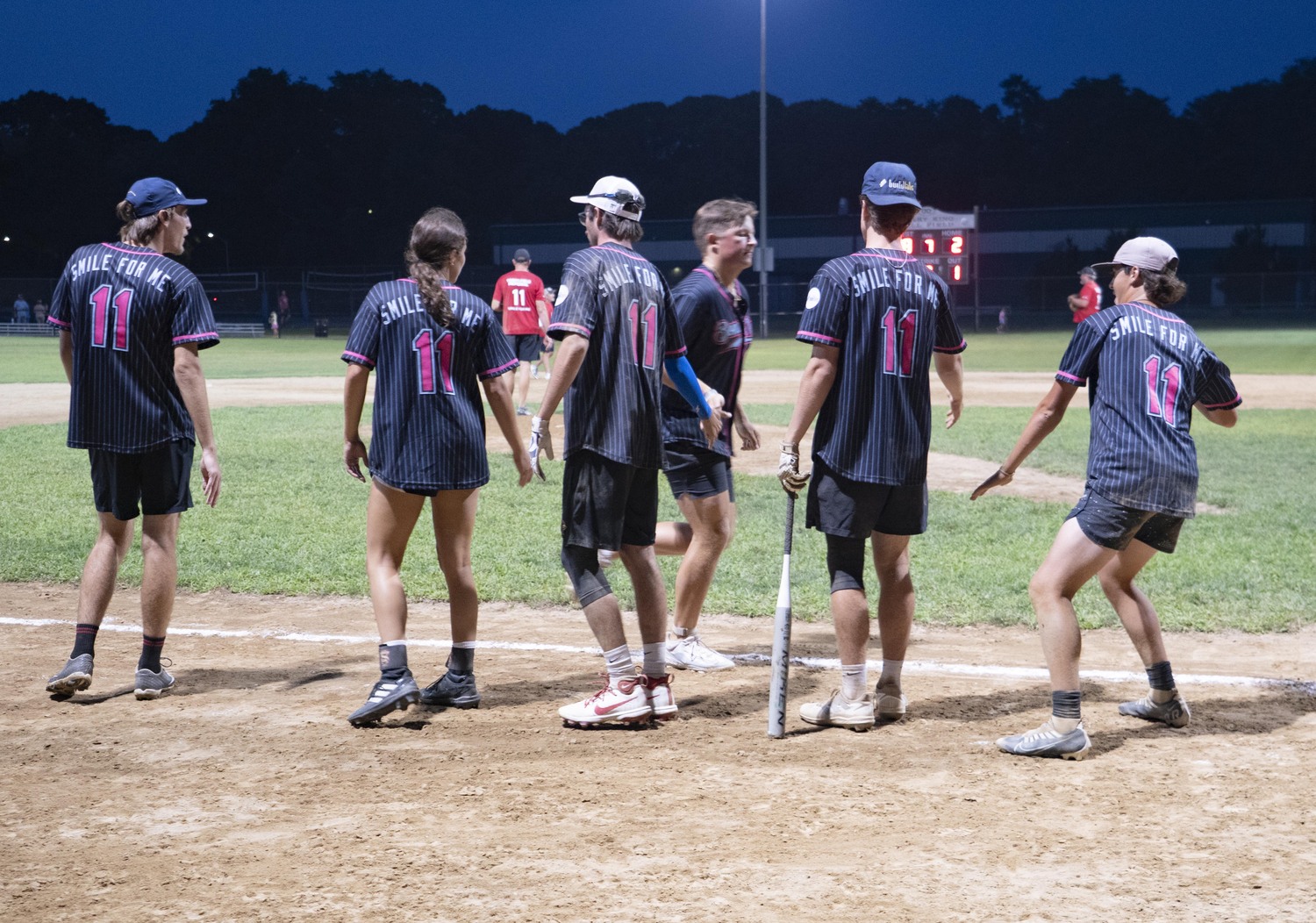 Will Darrell is congratulate by his Bonac Vice teammates.   DOUG KUNTZ