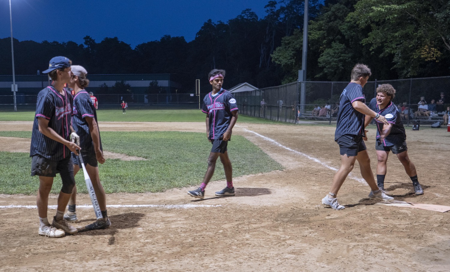 Will Darrell is congratulate by his Bonac Vice teammates.  DOUG KUNTZ